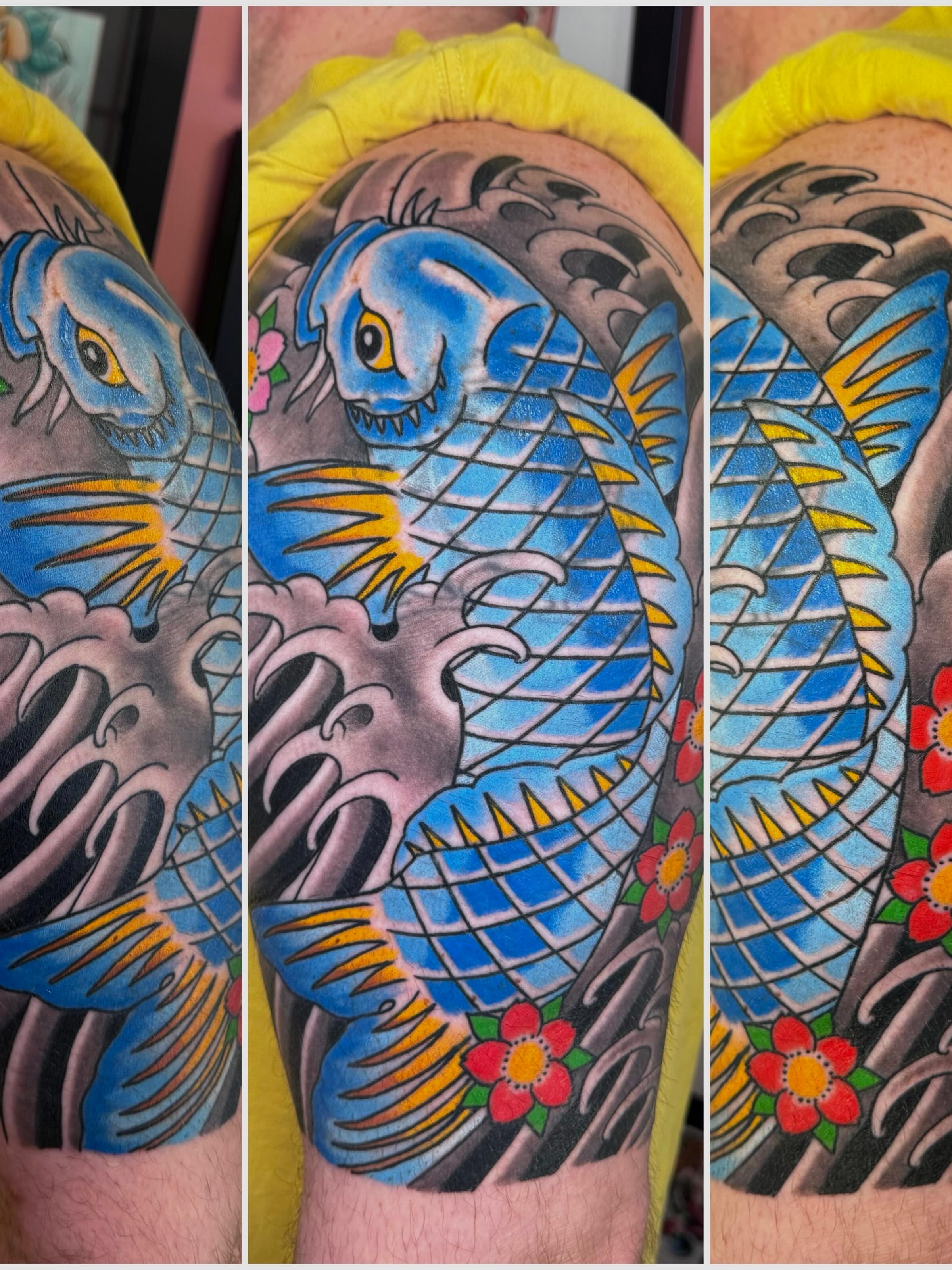 Koi fish American traditional tattoo on the forearm by Landon Lewis
