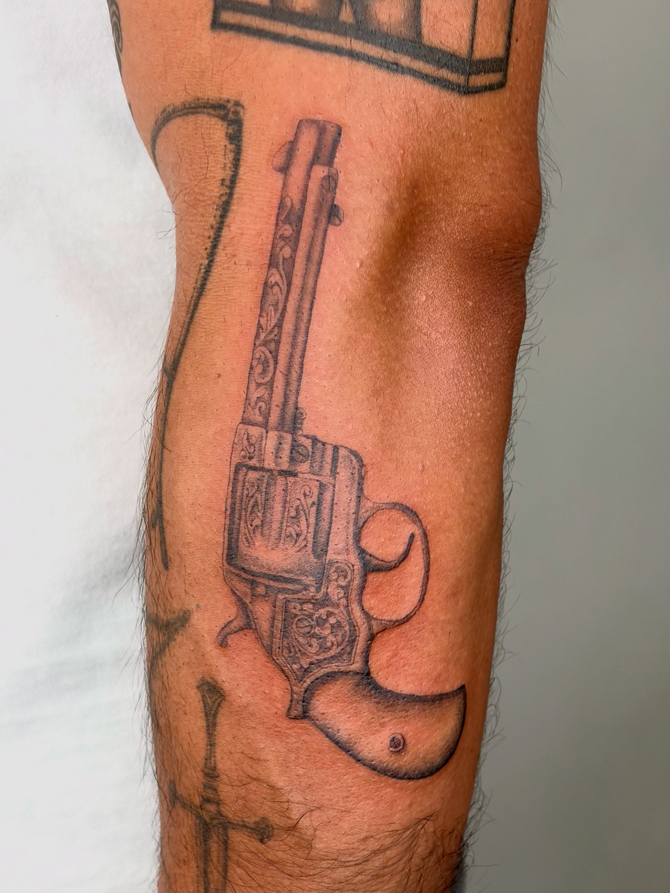 Revolver American traditional tattoo on the forearm by ๐ป๐๐๐๐๐๐๐ โงห*ยฐเฟ