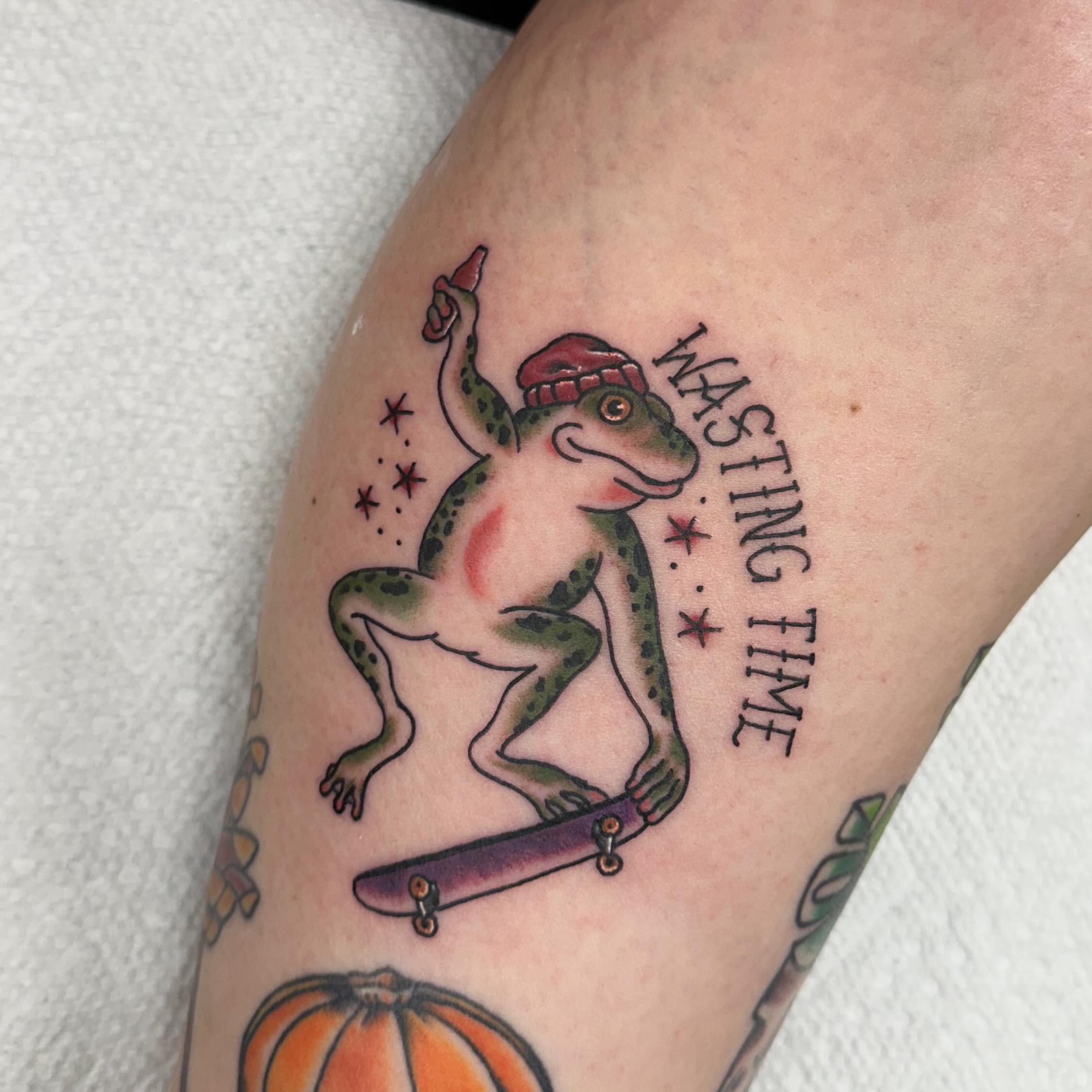 Frog on skateboard American traditional tattoo on the forearm by Nicki Hoverson