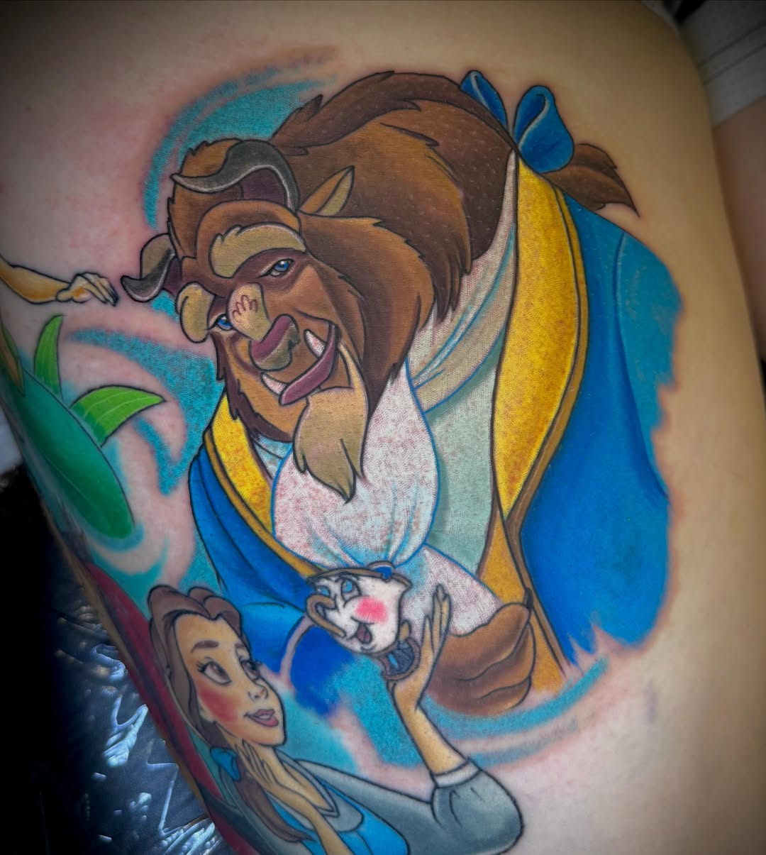 Beauty and the beast illustrative tattoo on the thigh by Justin Weins
