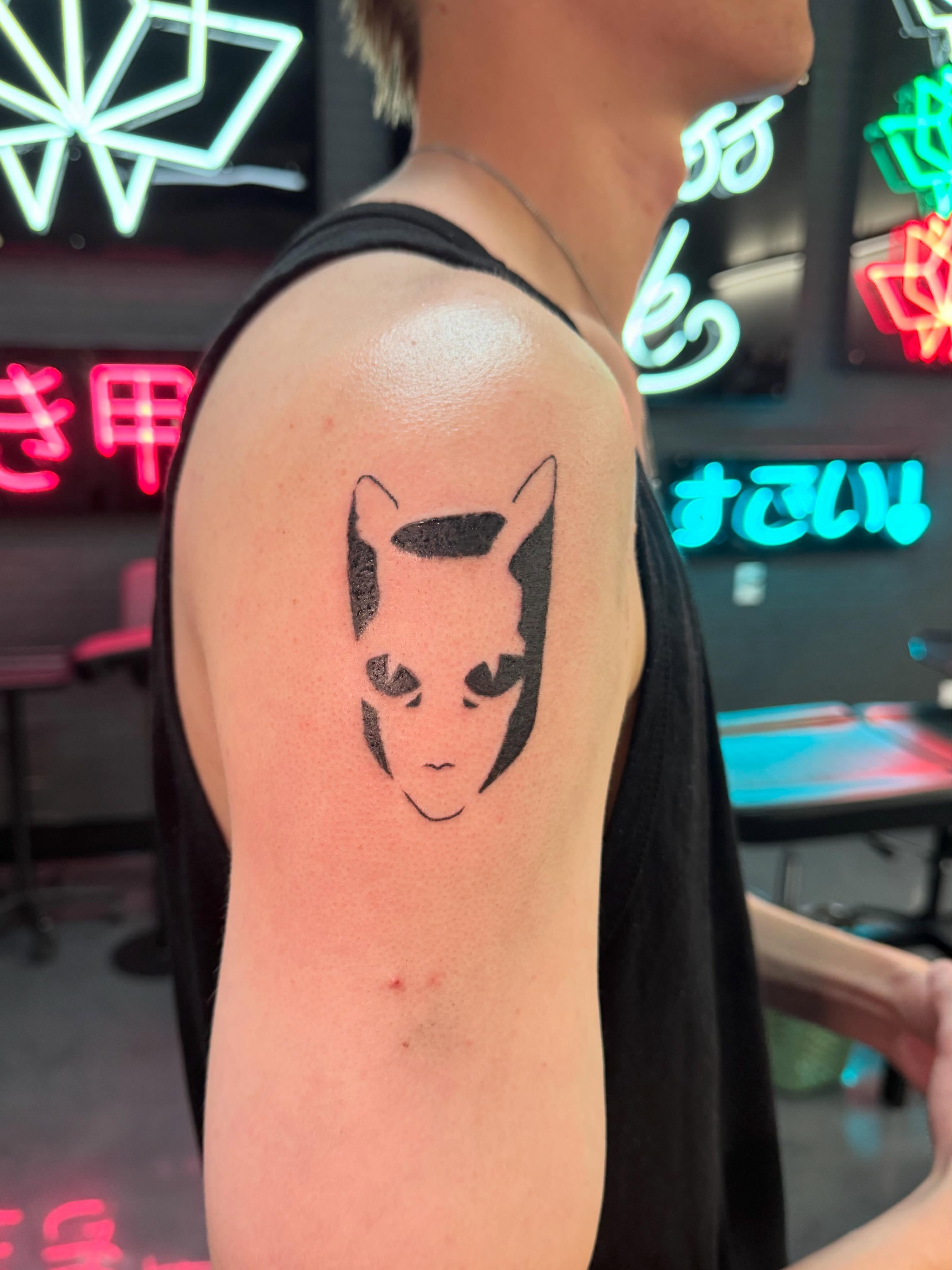 Cat face minimalist tattoo on the shoulder by Bunny 🐰