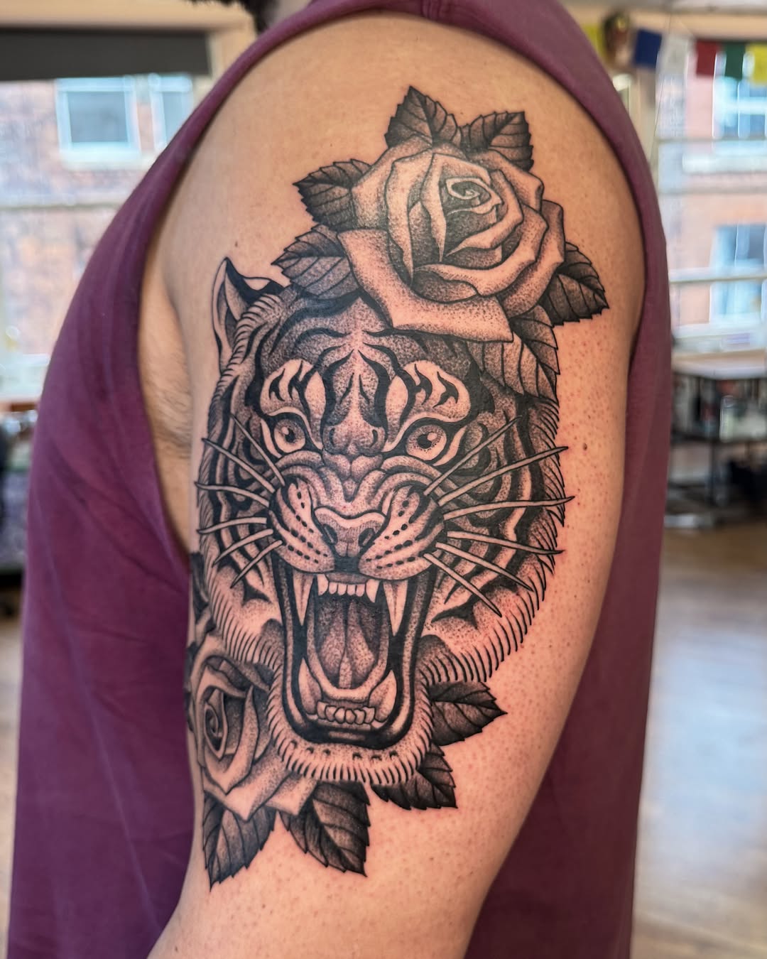 Tiger and roses dotwork tattoo on the shoulder by Jae Traditional Tattoo