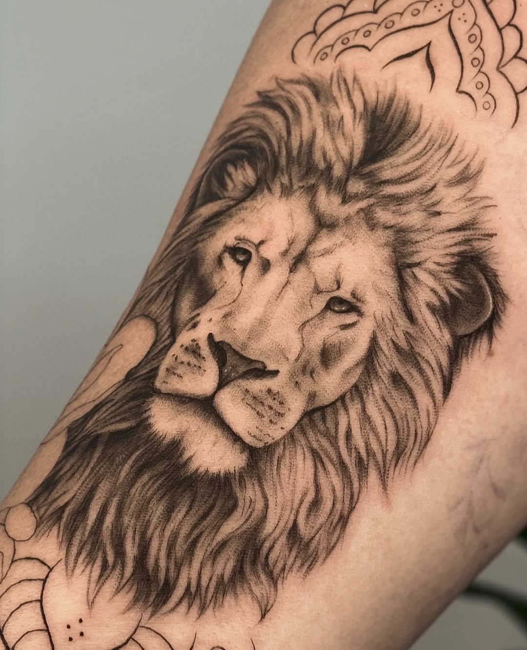 Lion portrait realism tattoo on the forearm by Gianna Rodriguez