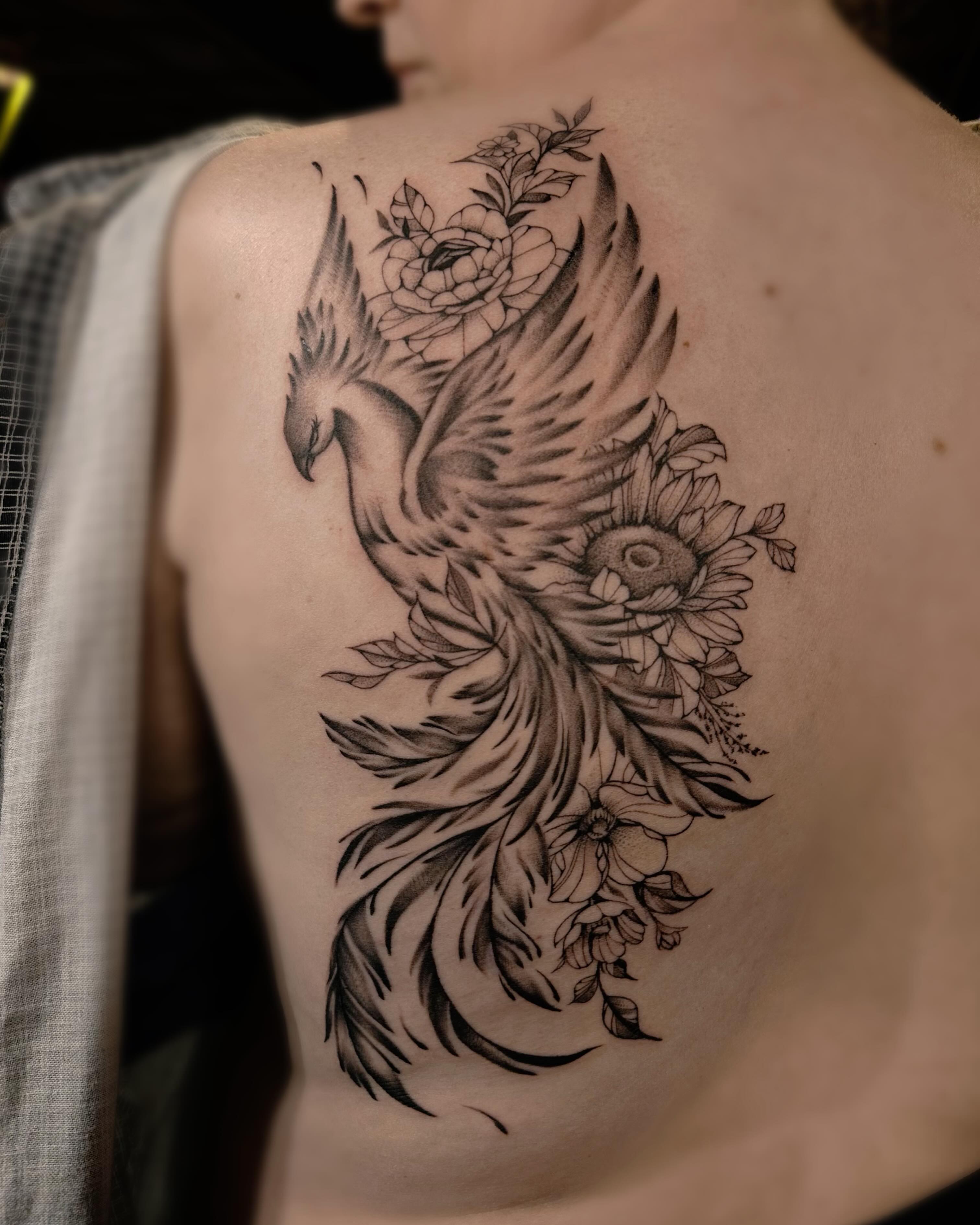 Phoenix black and grey tattoo on the back by Lissy Red
