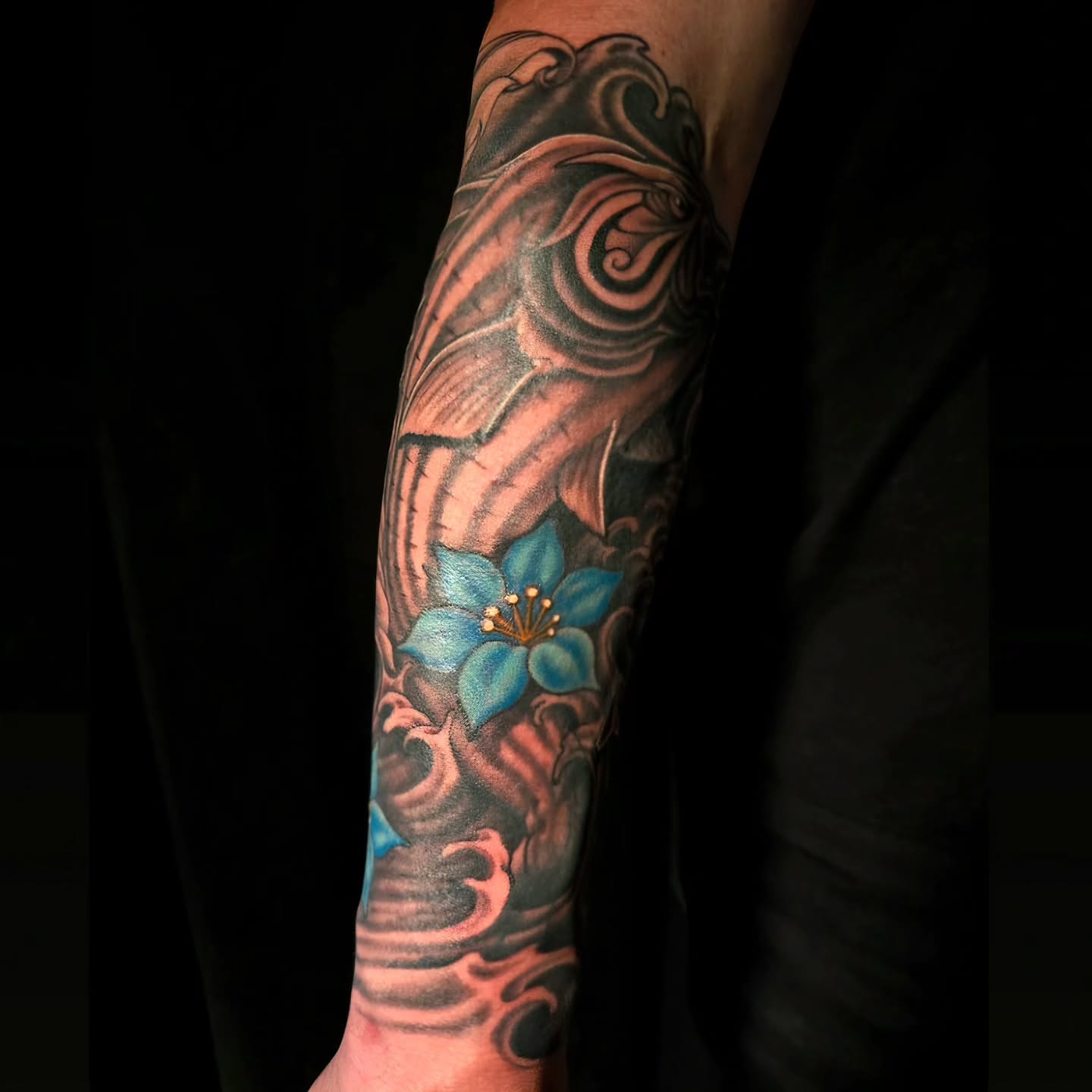 Blue flower japanese irezumi tattoo on the forearm by "Gentle"Jay Blondel