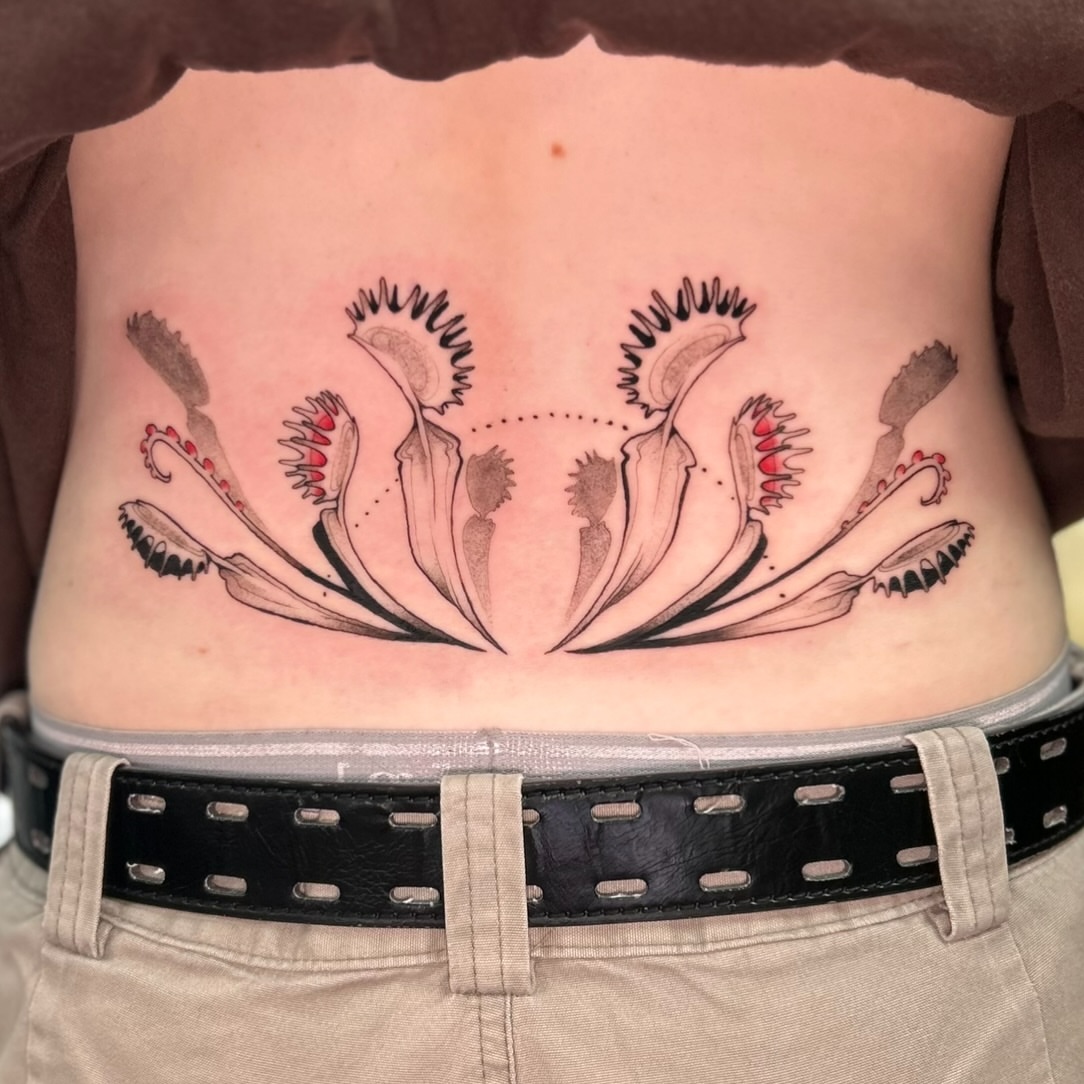 Flower black and grey tattoo on the torso by Maara Martinez