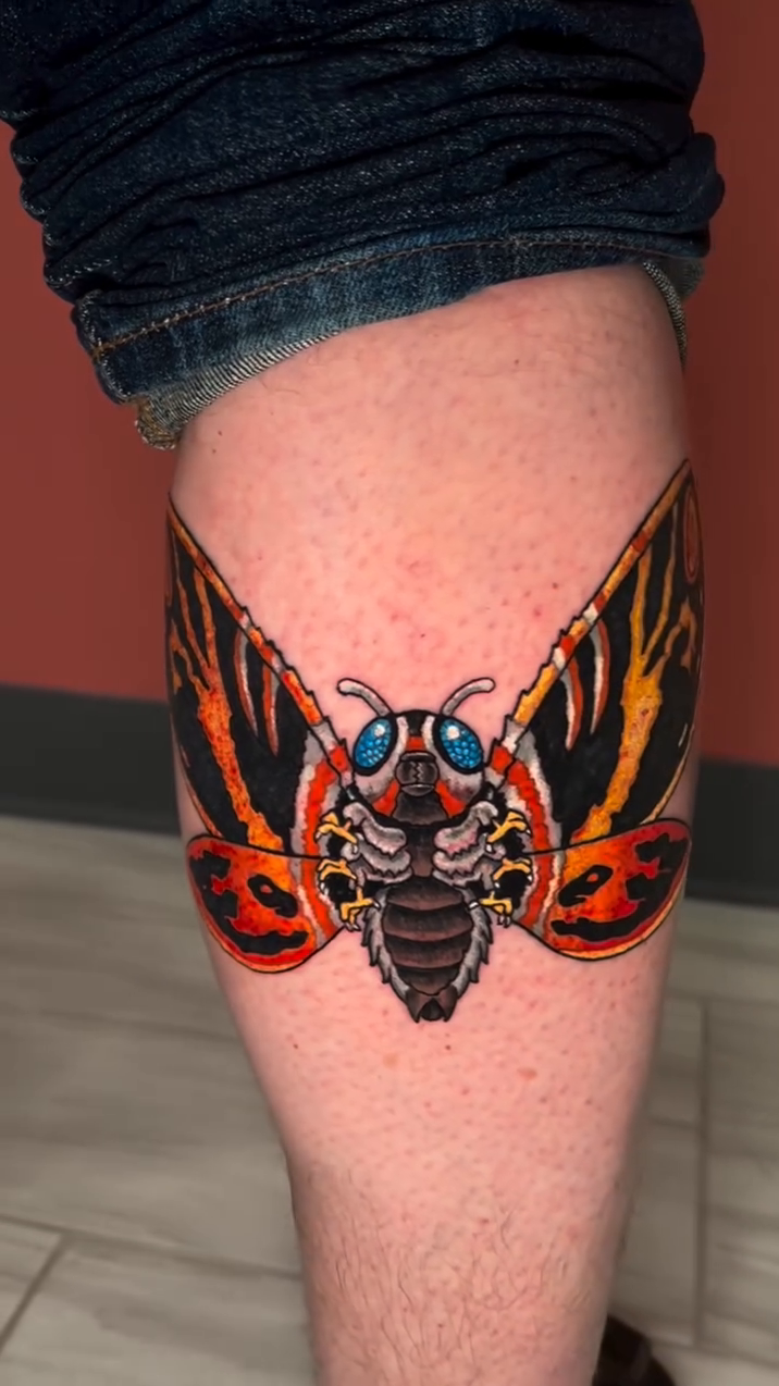 Mothra tattoo fine line tattoo on the leg by Justin Rivera