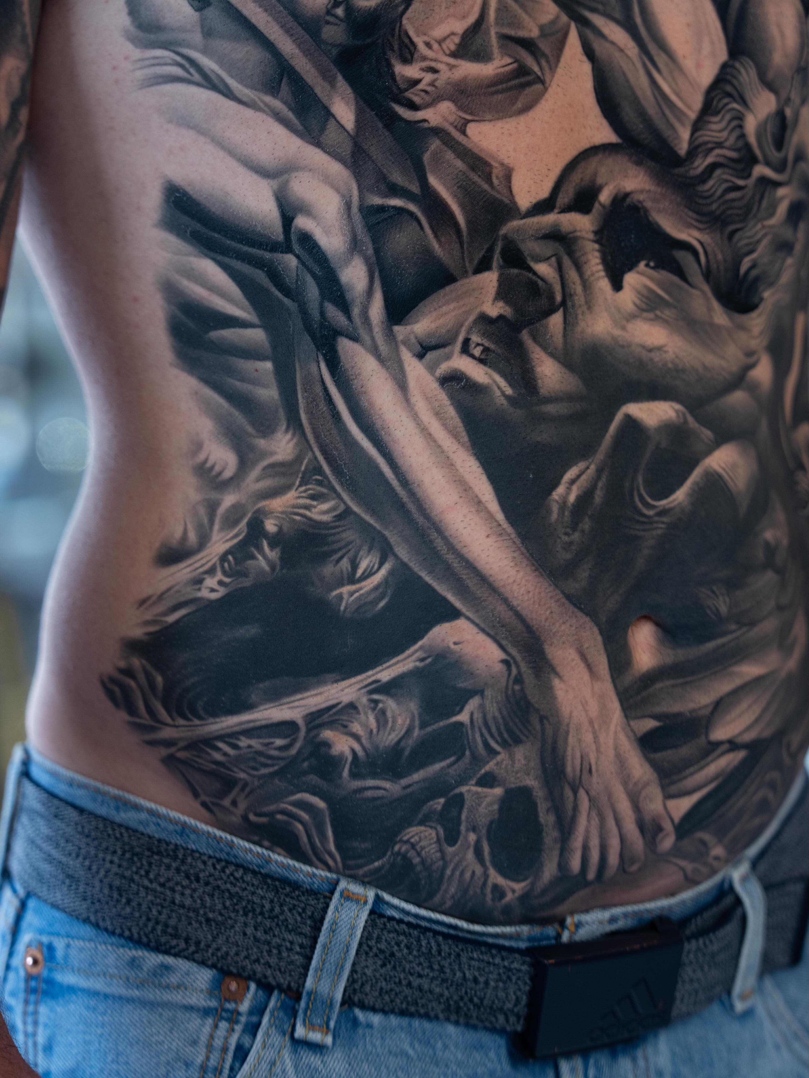 Statue realism tattoo on the torso by Reena Pho, Nashville, Tennessee