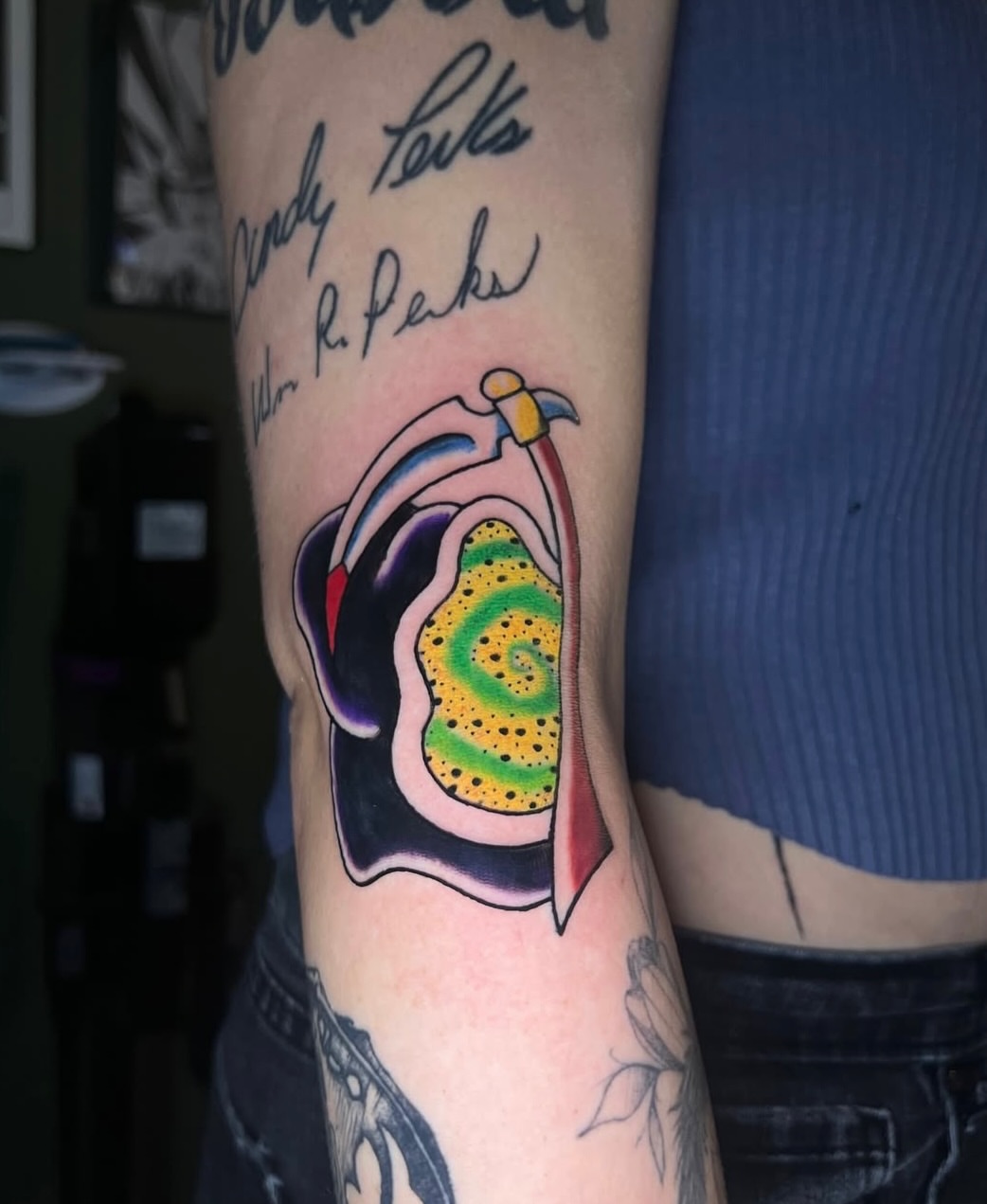 Flame dotwork tattoo on the forearm by Dustie Pitstick