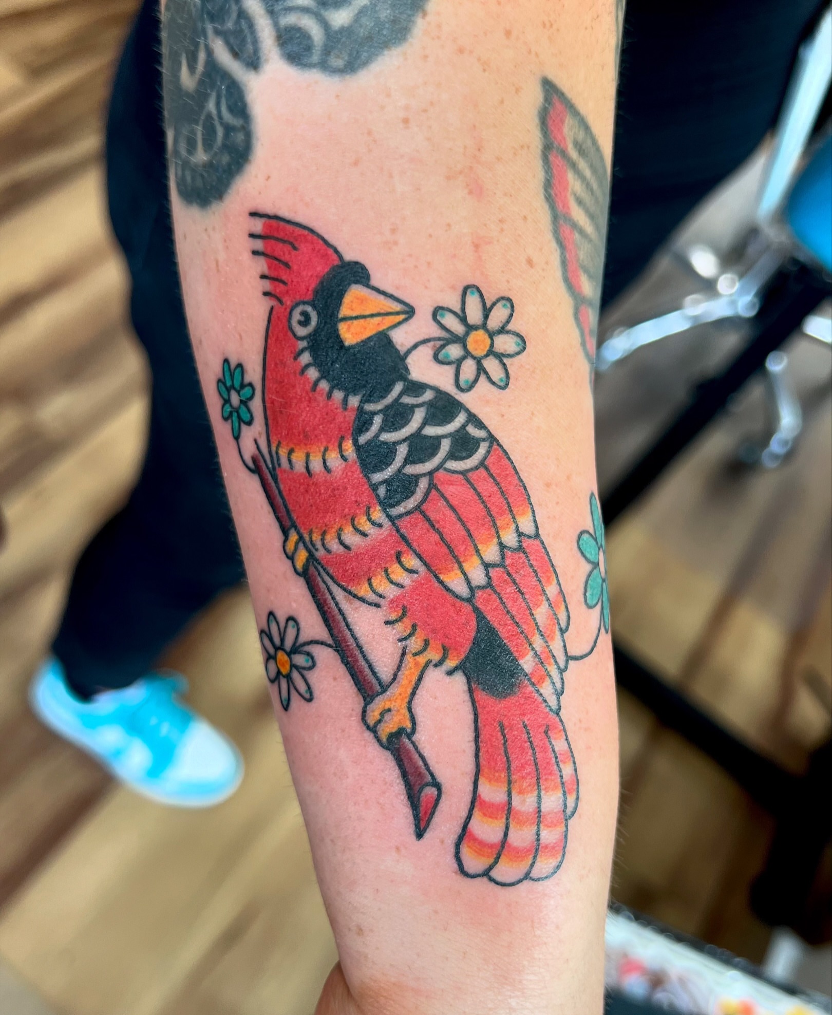 Cardinal bird American traditional tattoo on the forearm by Dustie Pitstick