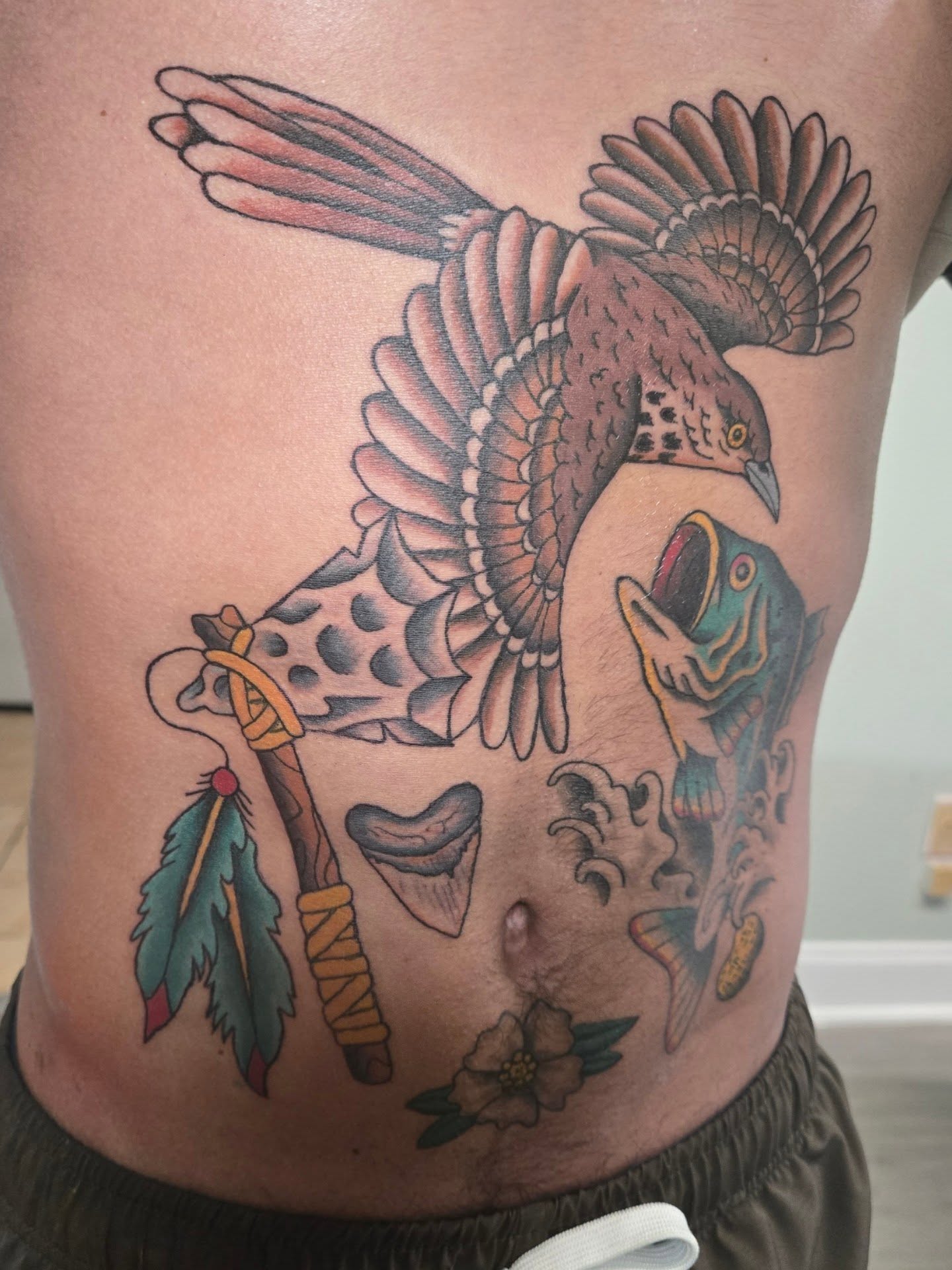 Bird and fish American traditional tattoo on the ribs by Matt Page