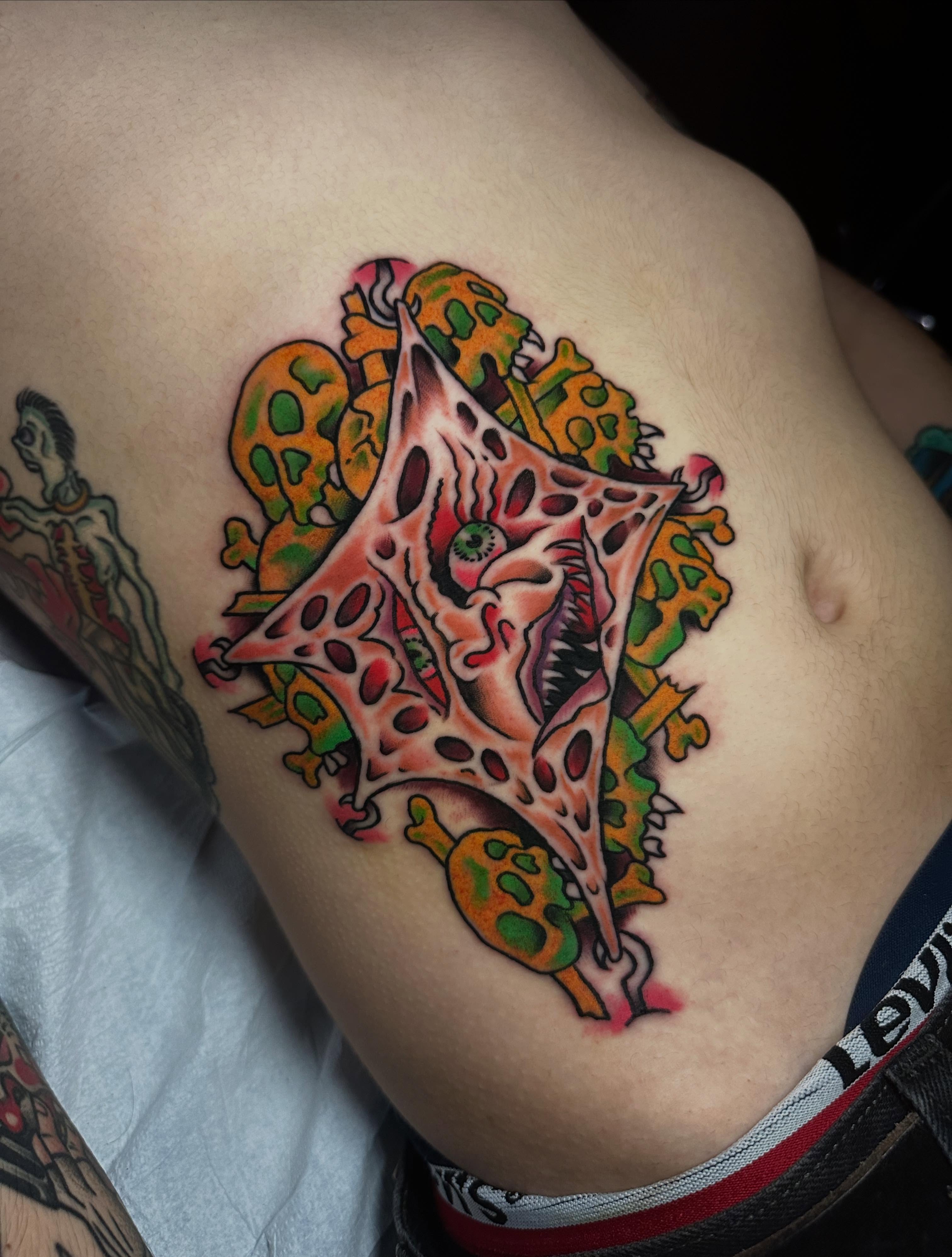 Geometric star geometric tattoo on the thigh by Chris Bishop