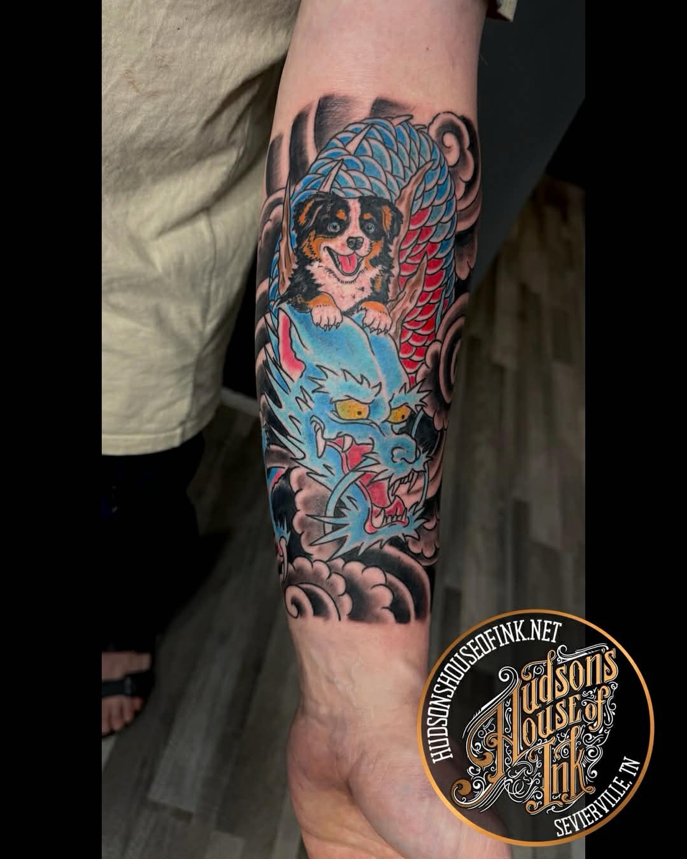 Dog riding dragon American traditional tattoo on the forearm by @rayscott_tattoo