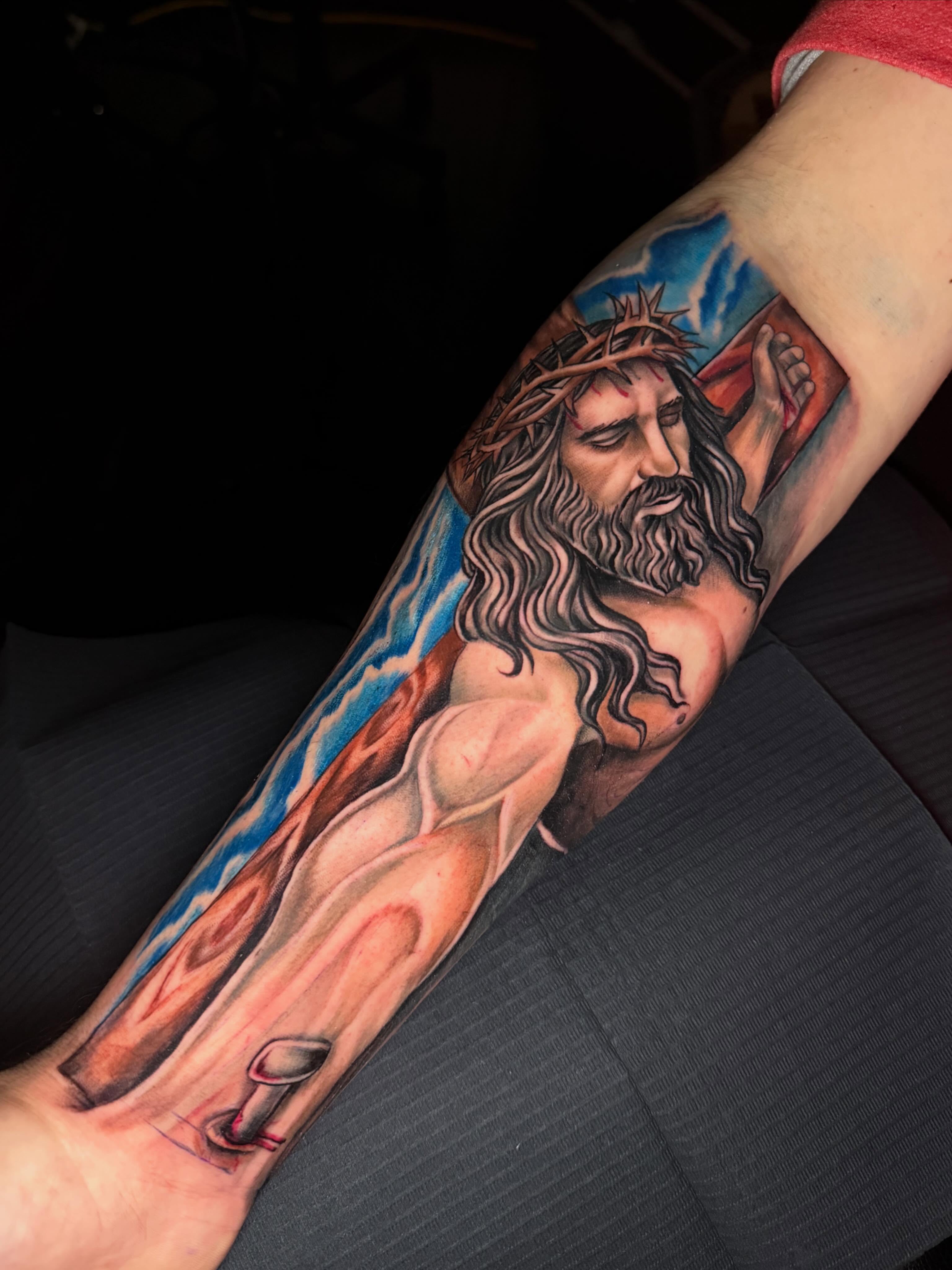 Religious figure realism tattoo on the forearm by Daero Tattoo, New York, New York