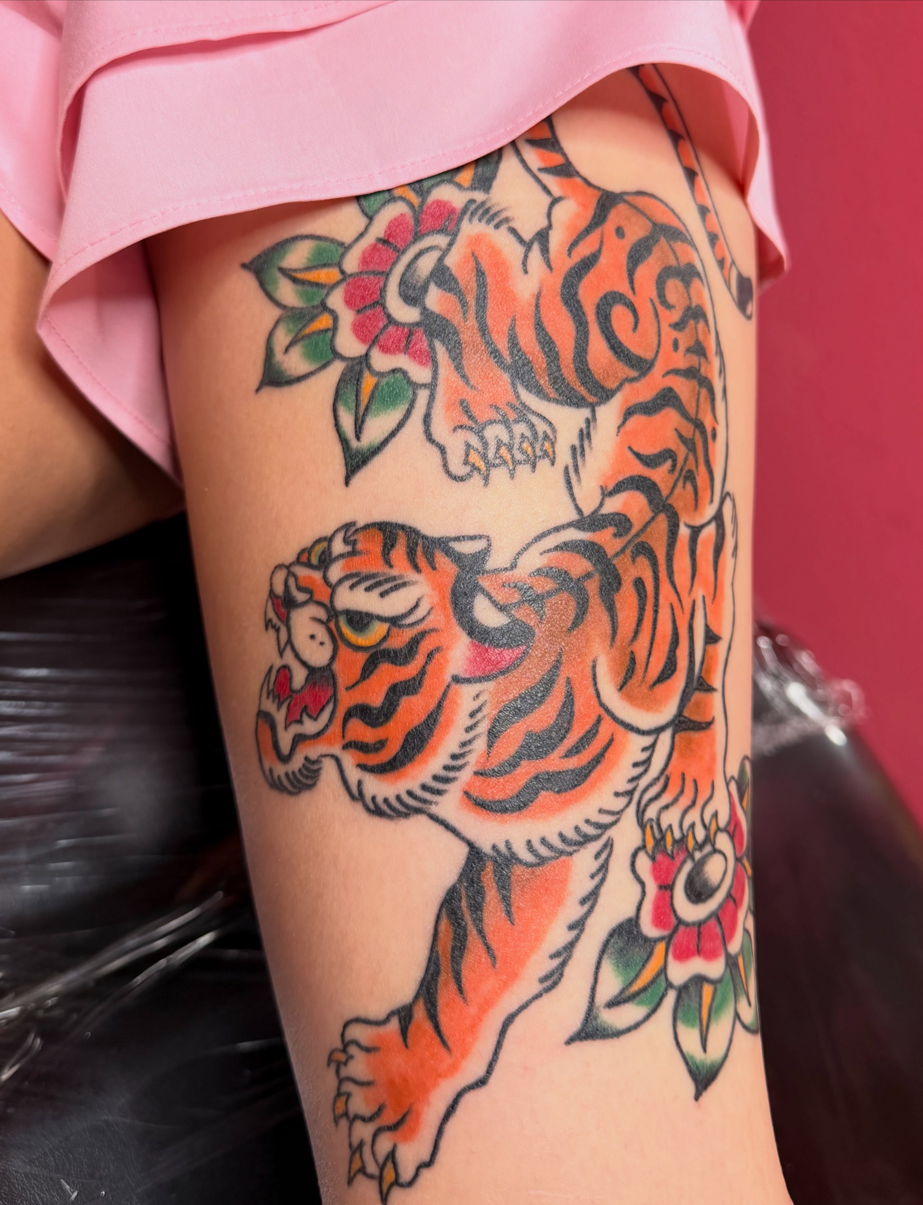 Tiger American traditional tattoo on the thigh by Kelsey Turnis