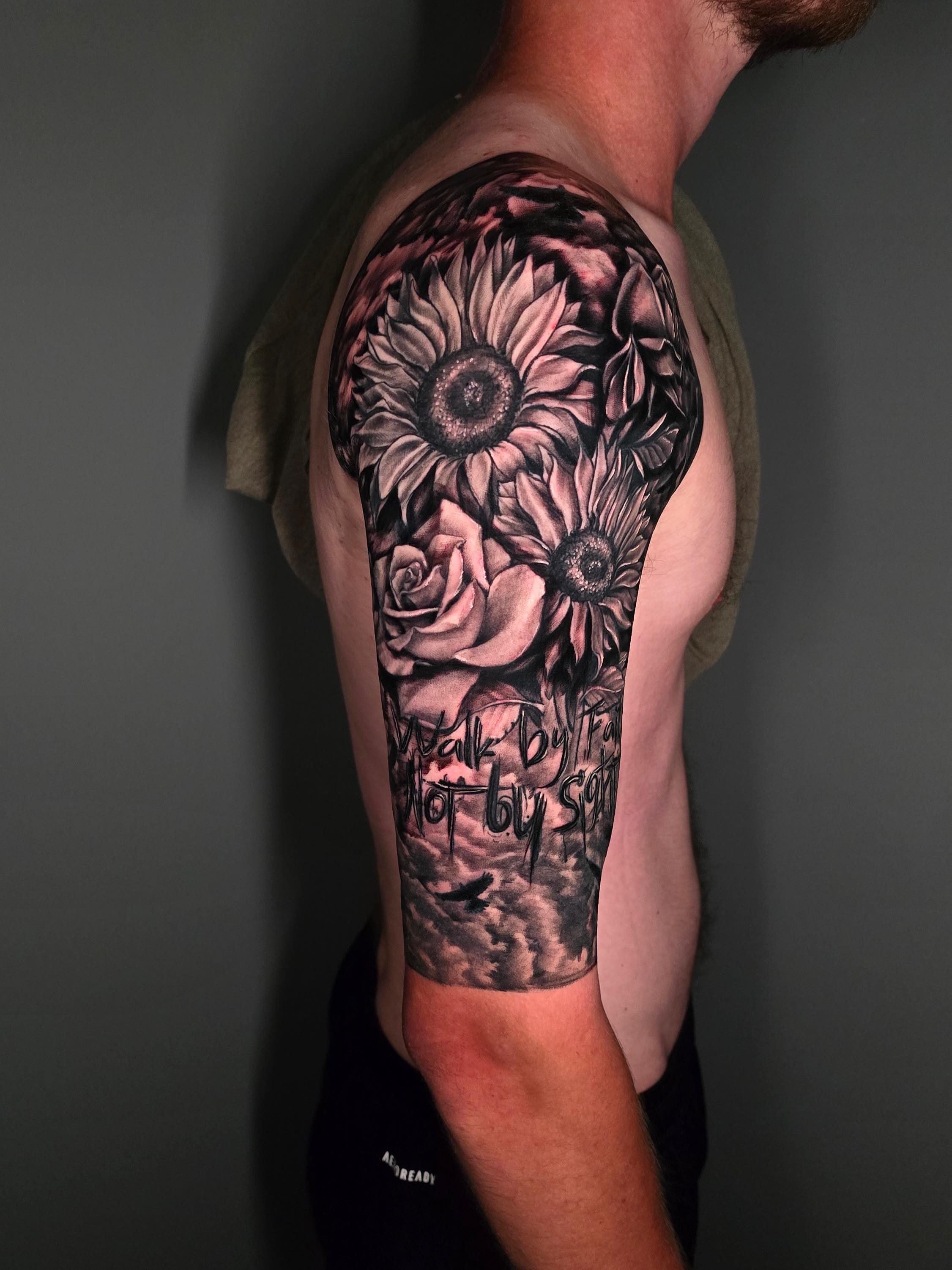 Sunflower and rose realism tattoo on the shoulder by Tank Maass