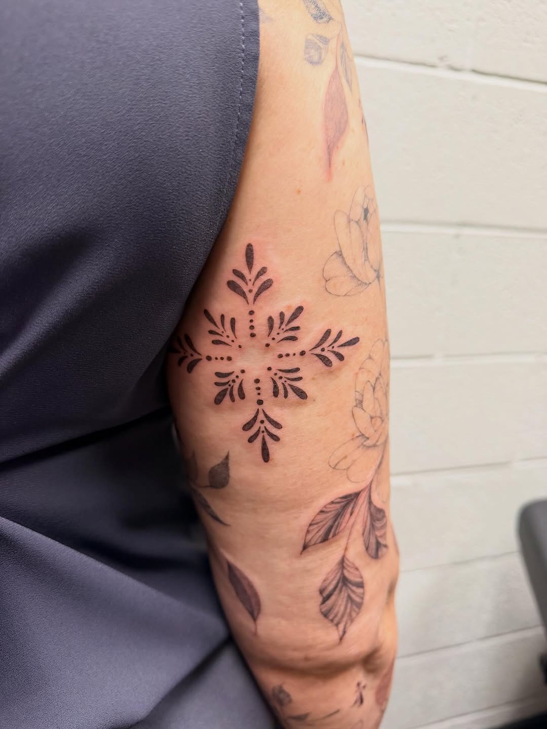Tattoo by @reverie_finelines — dotwork, ornamental