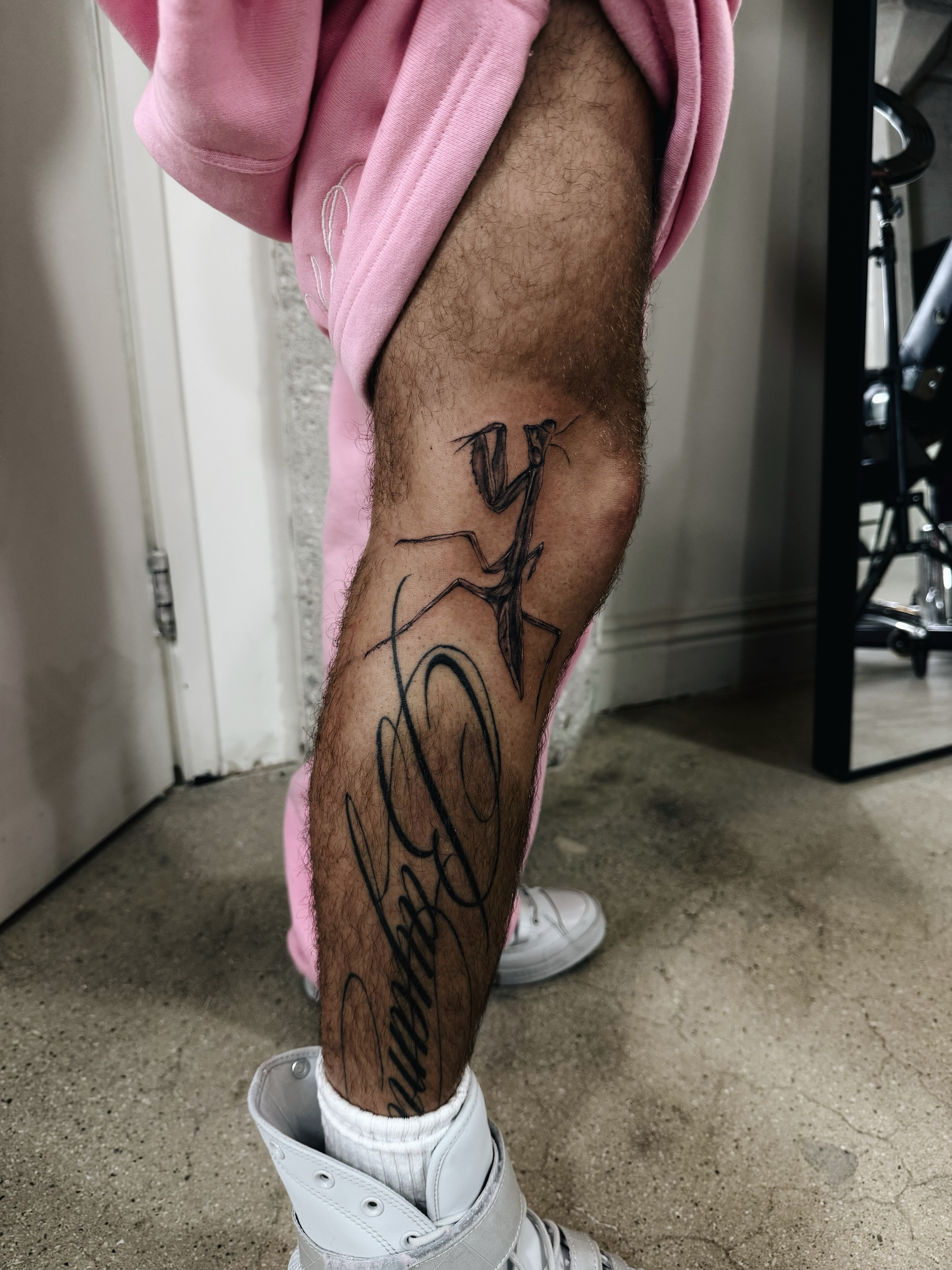 Praying mantis black and grey tattoo on the calf by viktoria raquel