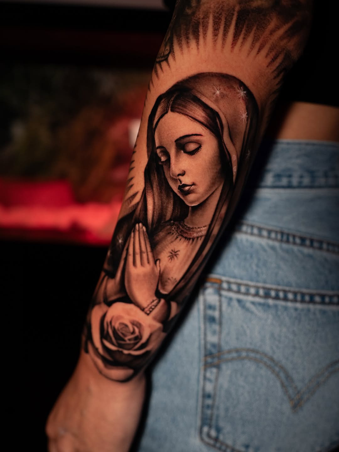 Praying Virgin Mary with a rose Chicano tattoo on the forearm by Apolo