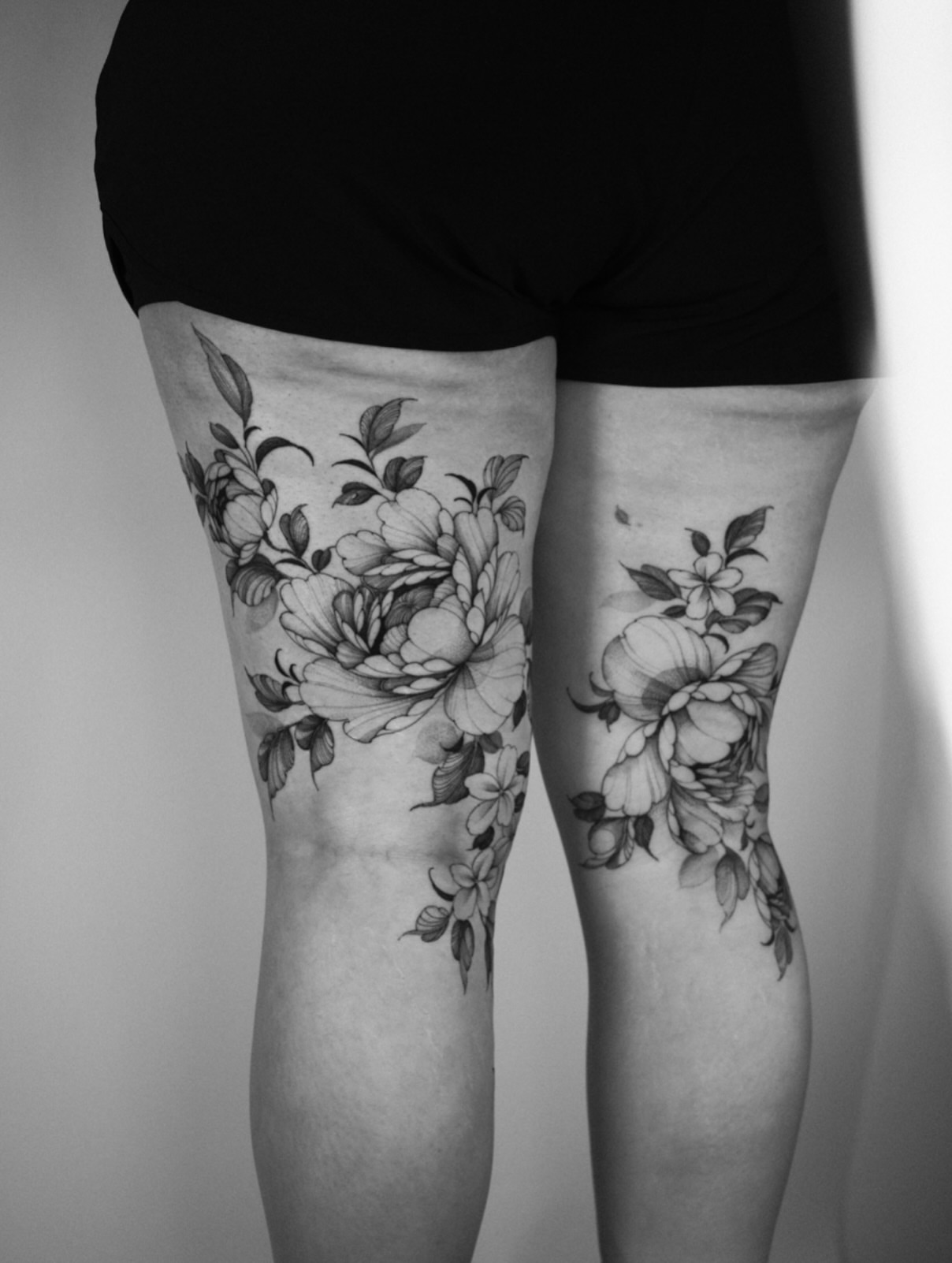 Floral bouquet black and grey tattoo on the thigh by LORIE π€ Floral Tattoo Artist, Los Angeles, California