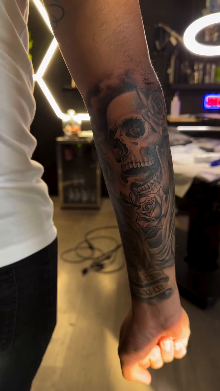 Skull and roses sleeve realism tattoo on the forearm by Greg Romero (el chamo), Millcreek, Utah