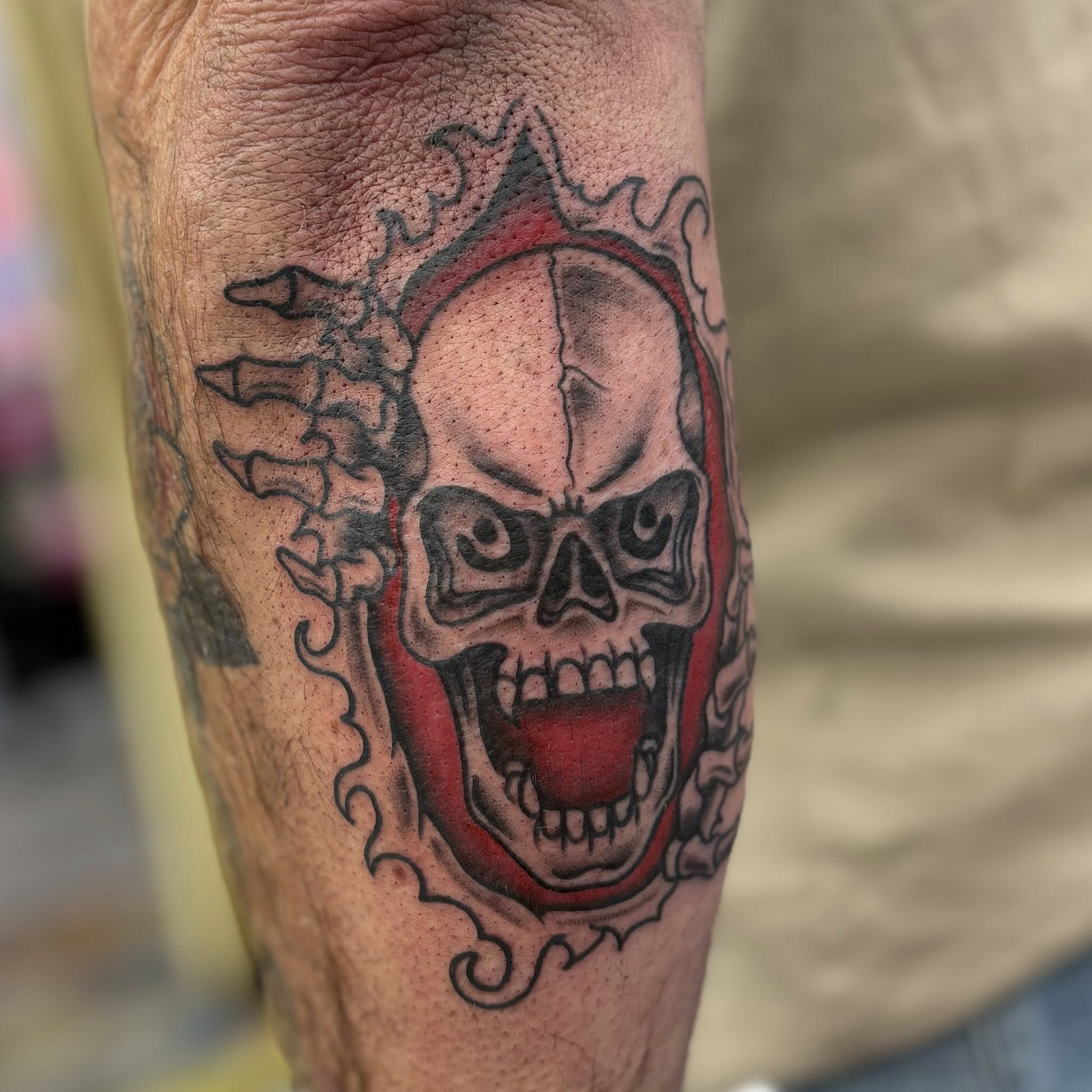 Skull American traditional tattoo on the forearm by Jon Anderson