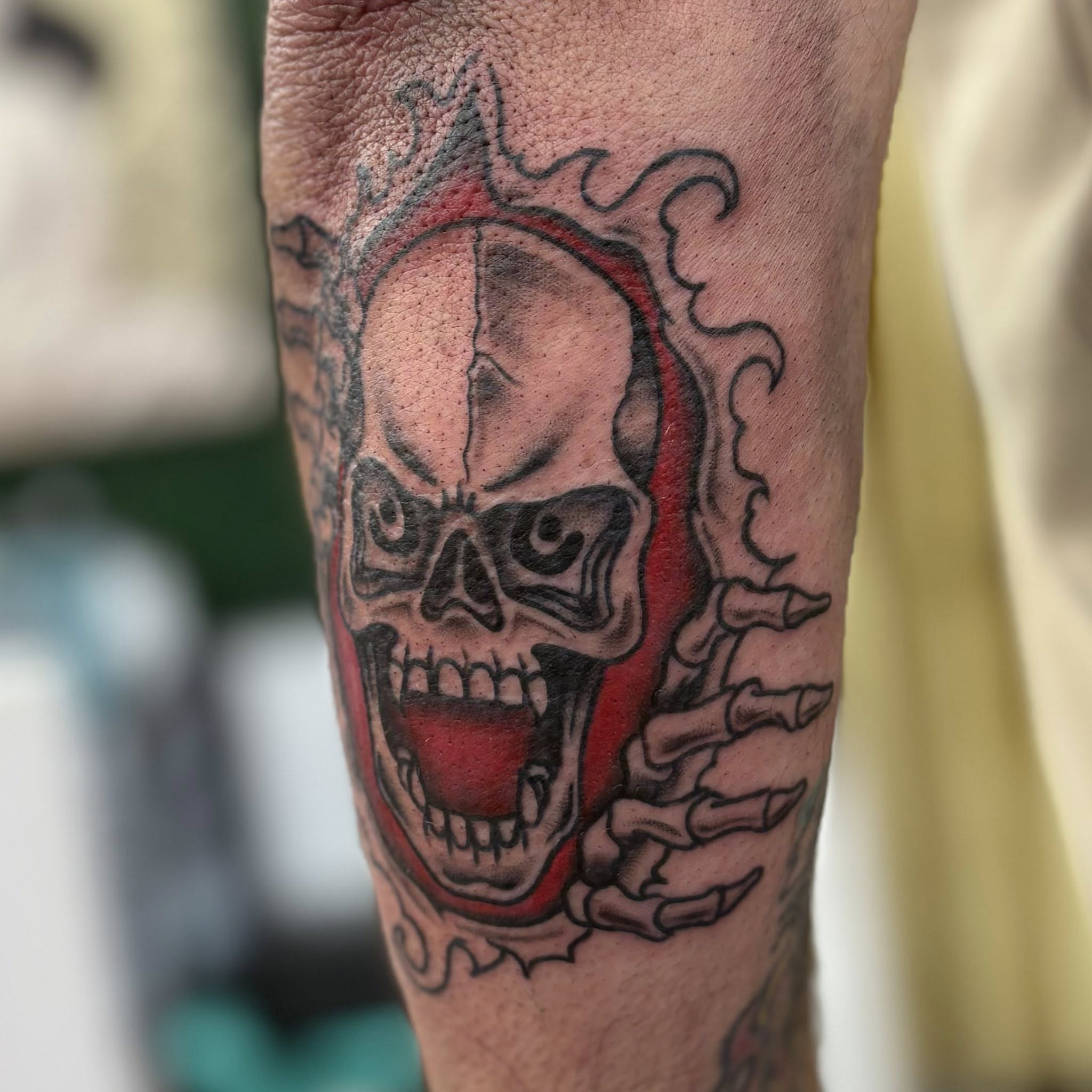 Skull American traditional tattoo on the forearm by Jon Anderson