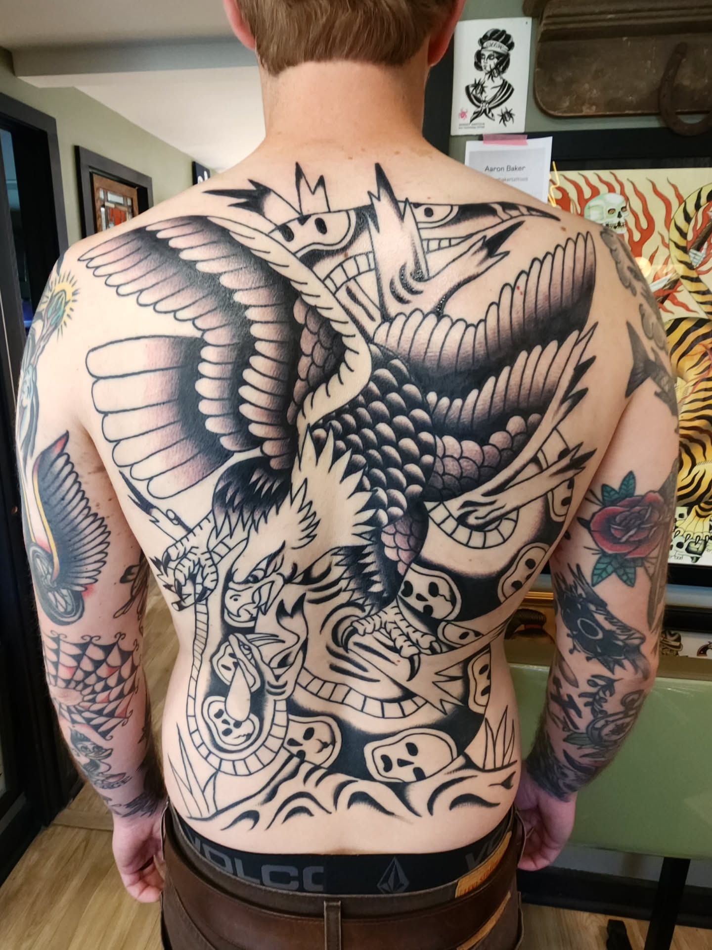 Dragon and phoenix American traditional tattoo on the back by πππππ