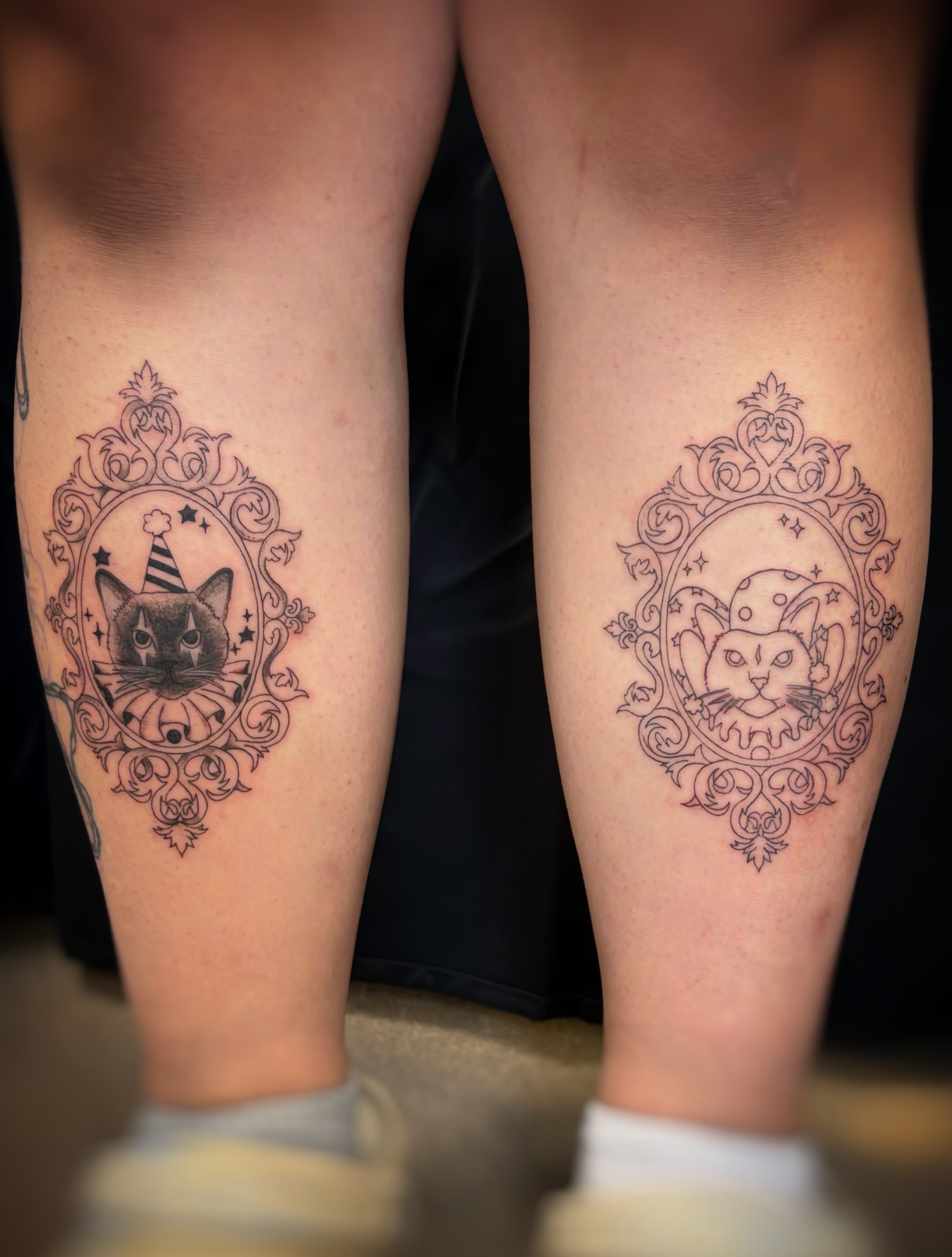Cat black and grey tattoo on the leg by Holly