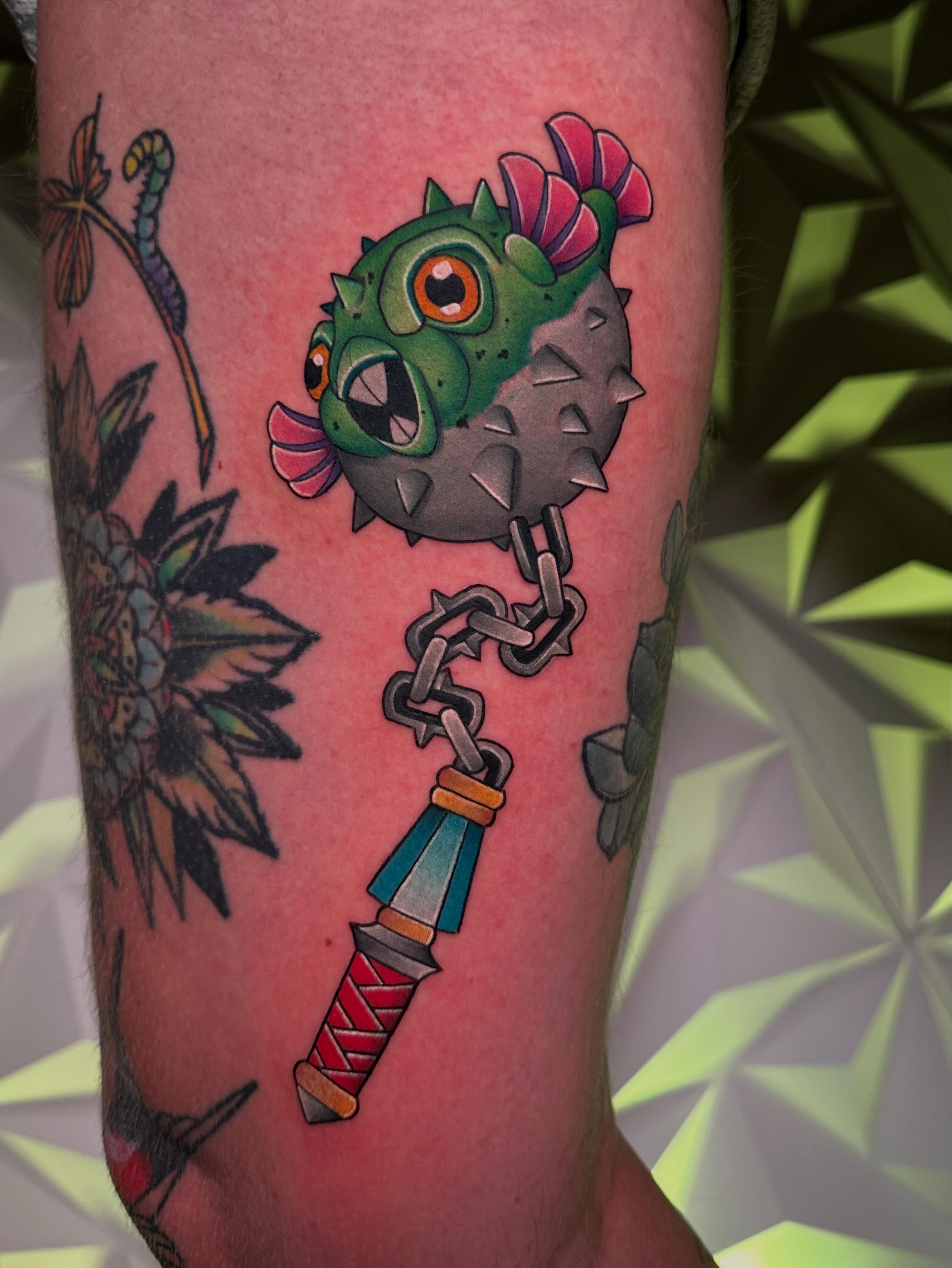 Puffer fish with chain new school tattoo on the forearm by Chi, Charlotte, North Carolina