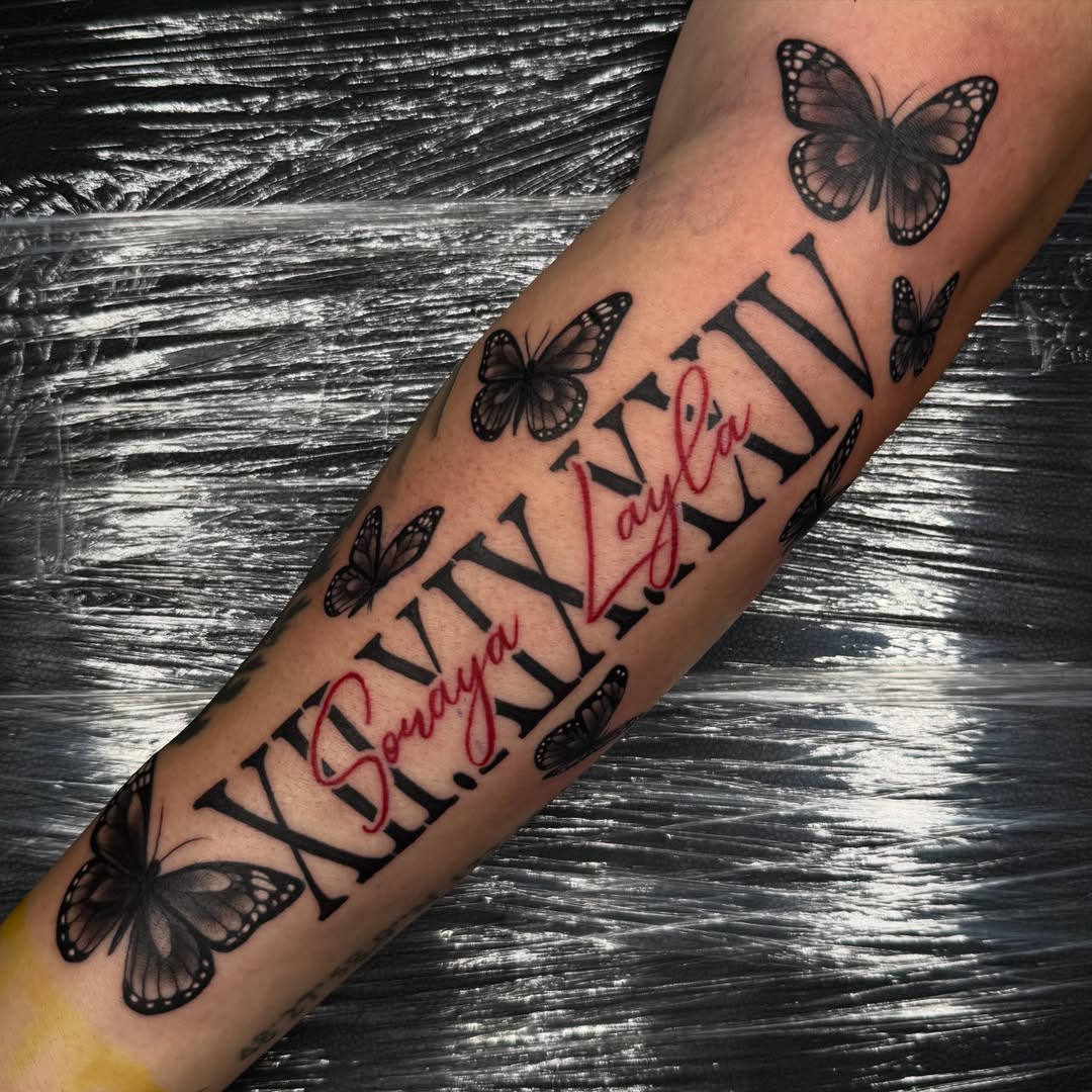 Butterflies and names black and grey tattoo on the forearm by Elijah East