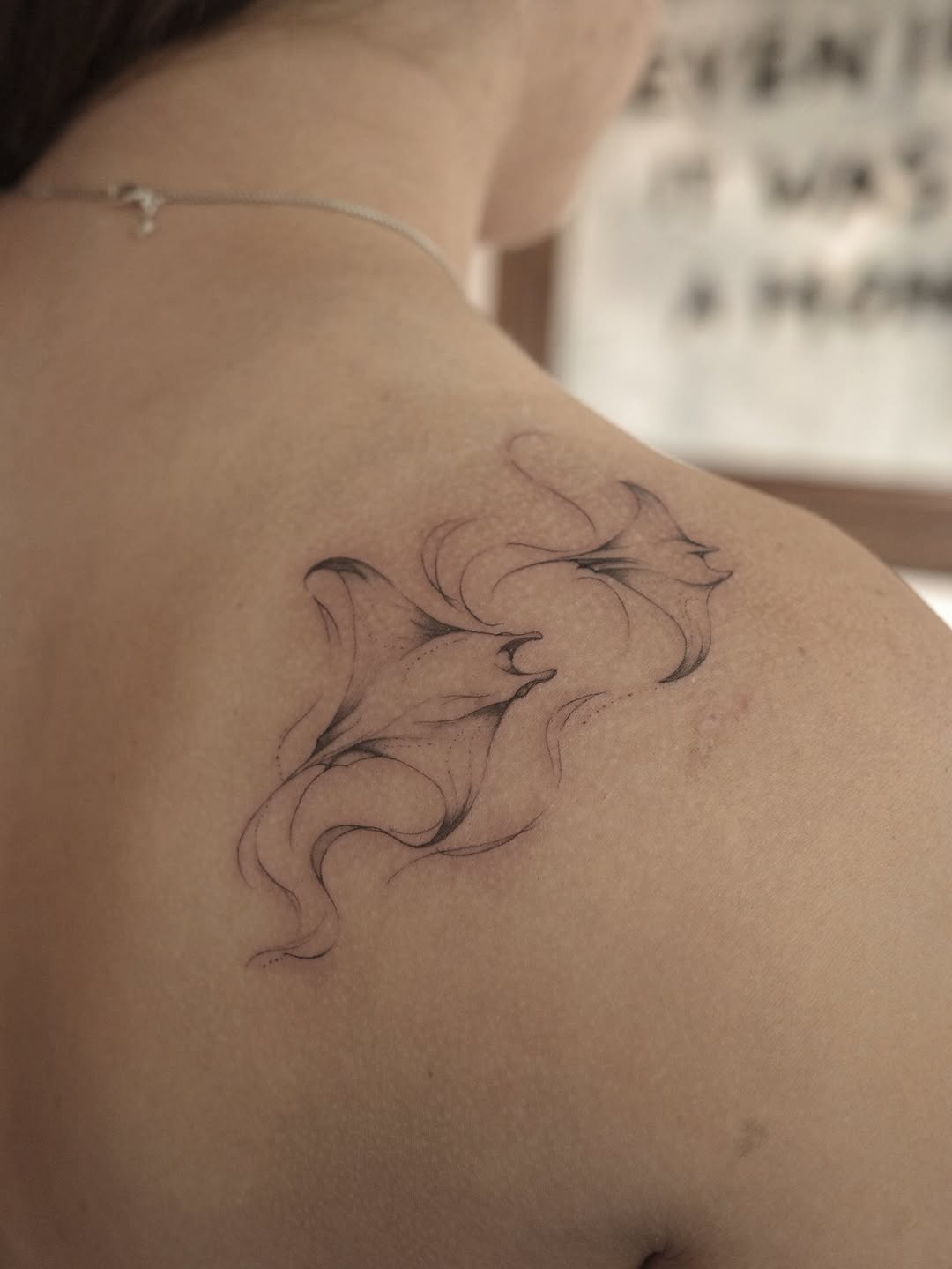 Two manta rays fine line tattoo on the shoulder by It’s ya girl, KB