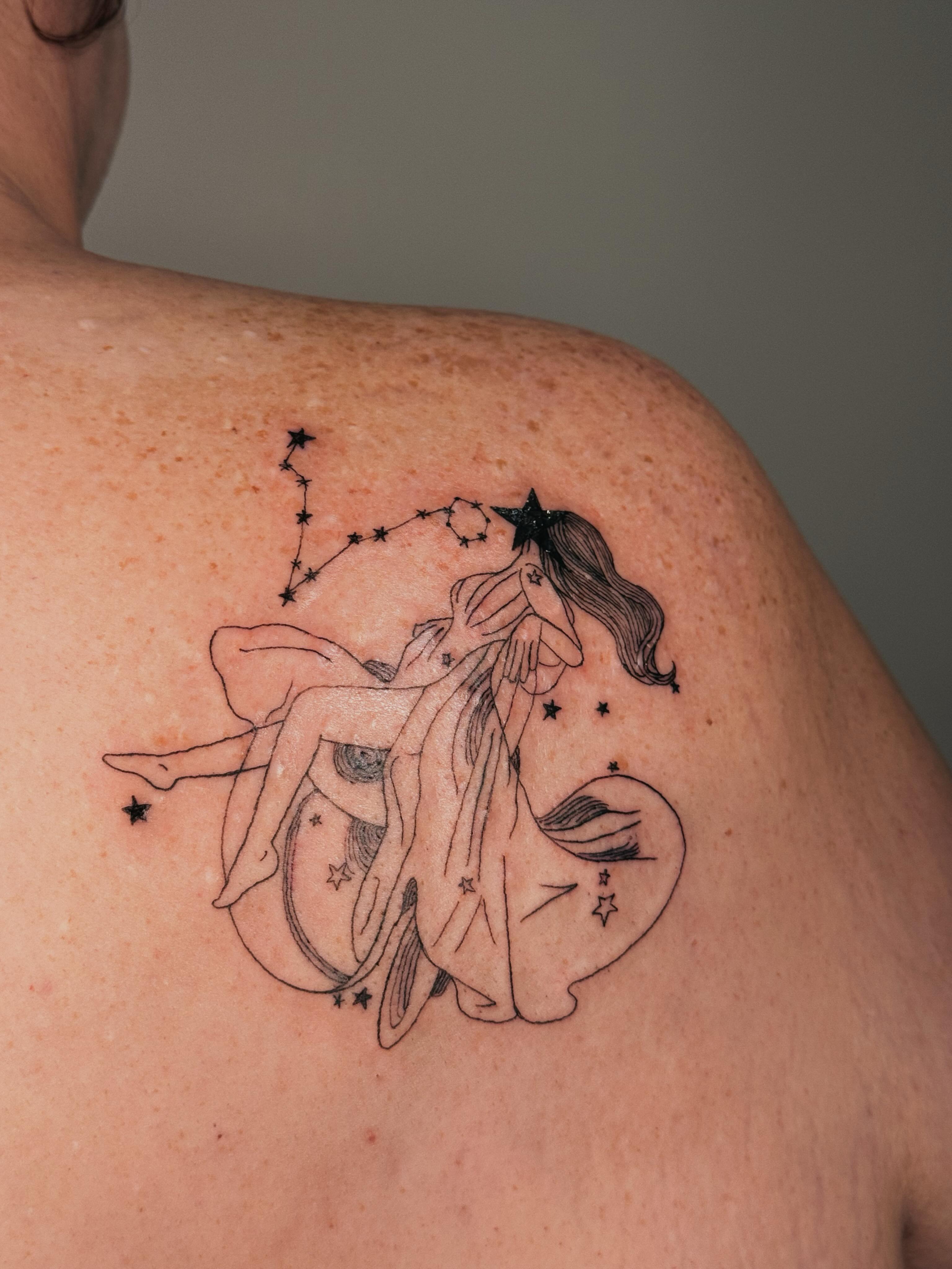 Mermaid constellation black and grey tattoo on the shoulder by Paulina Vazquez