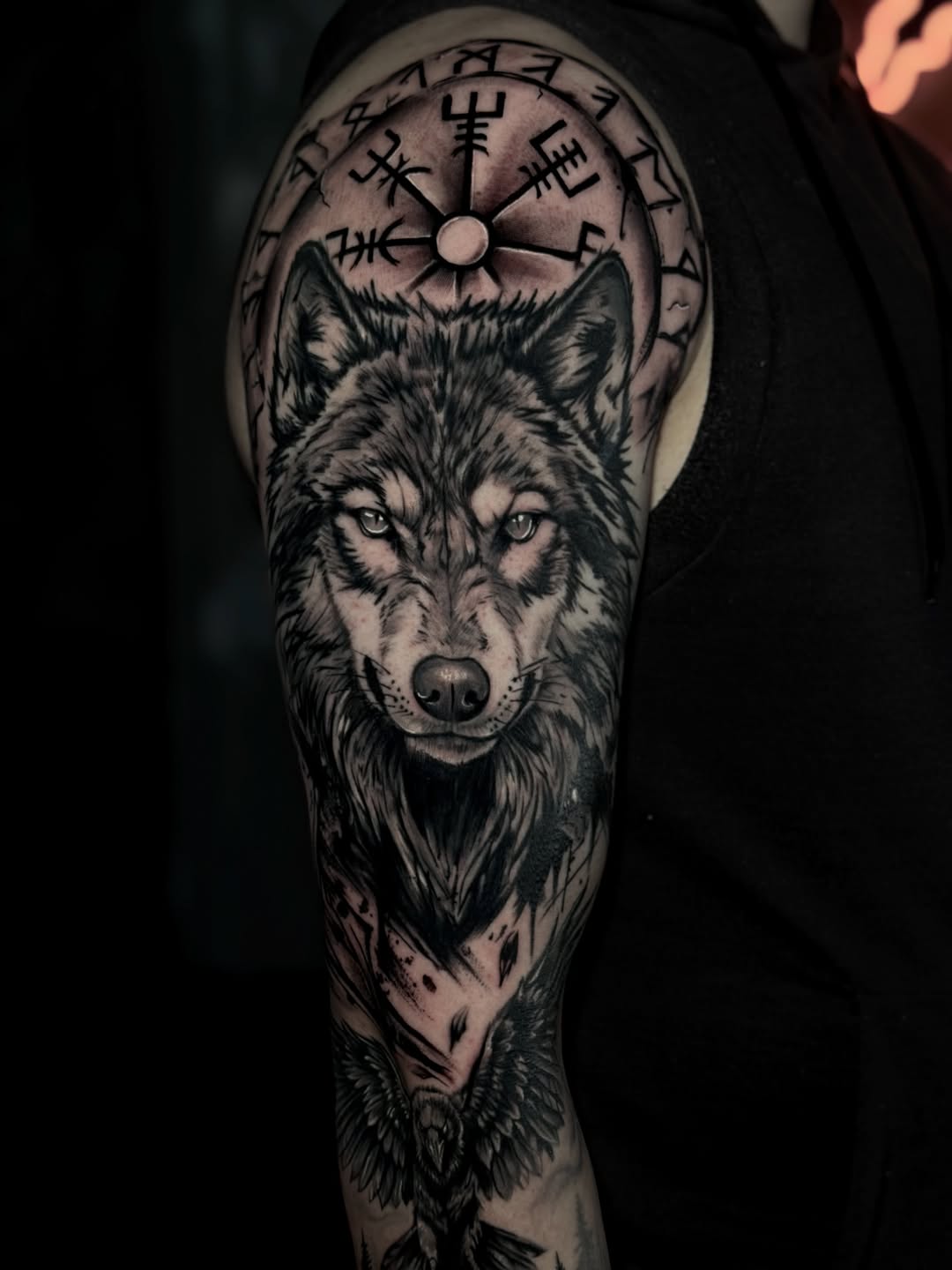 Wolf and raven with runic compass realism tattoo on the forearm by Keyla Valdes, Miami, Florida