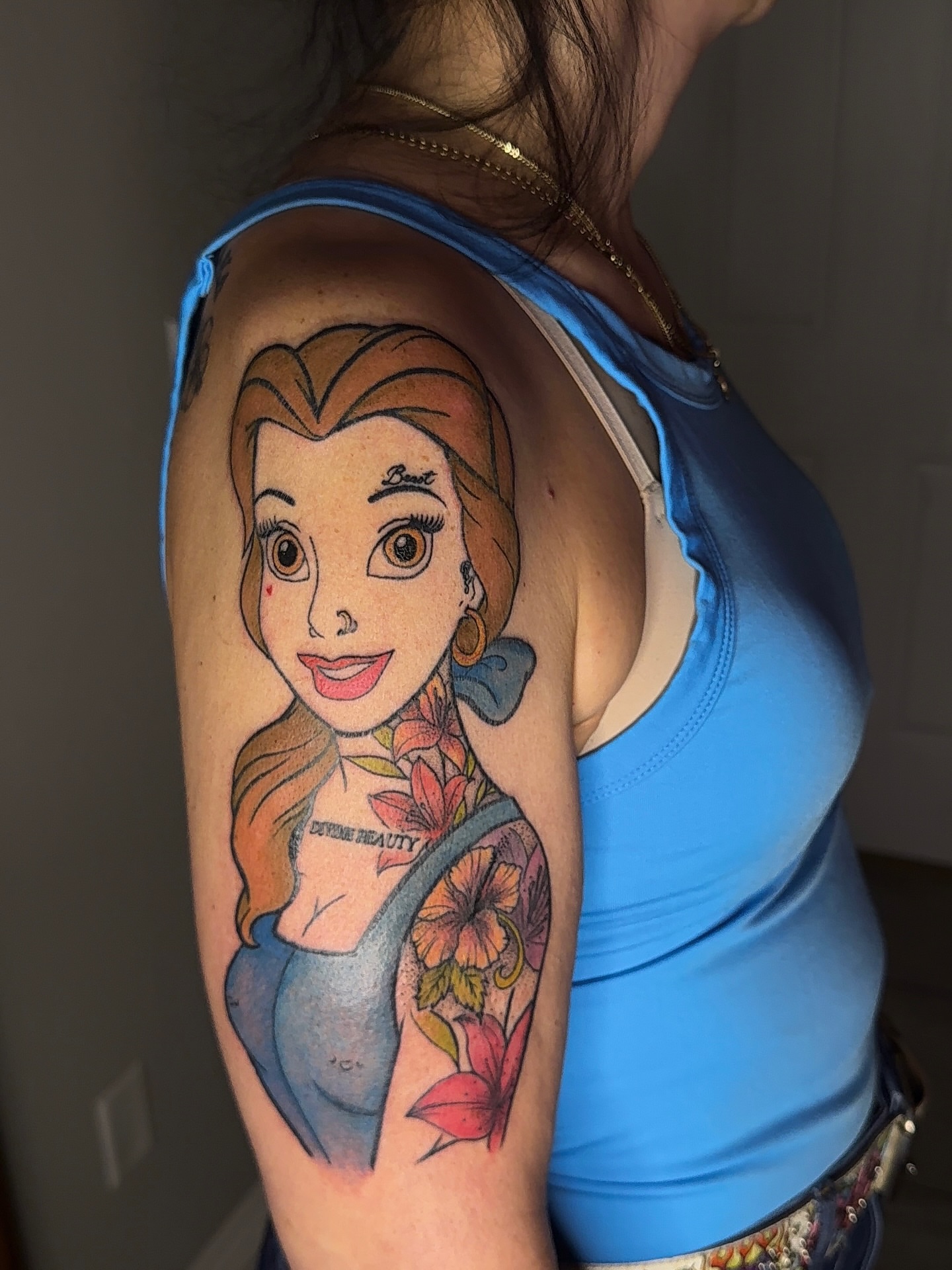 Belle realism tattoo on the upper arm by XoticTherapy, Las Vegas, Nevada