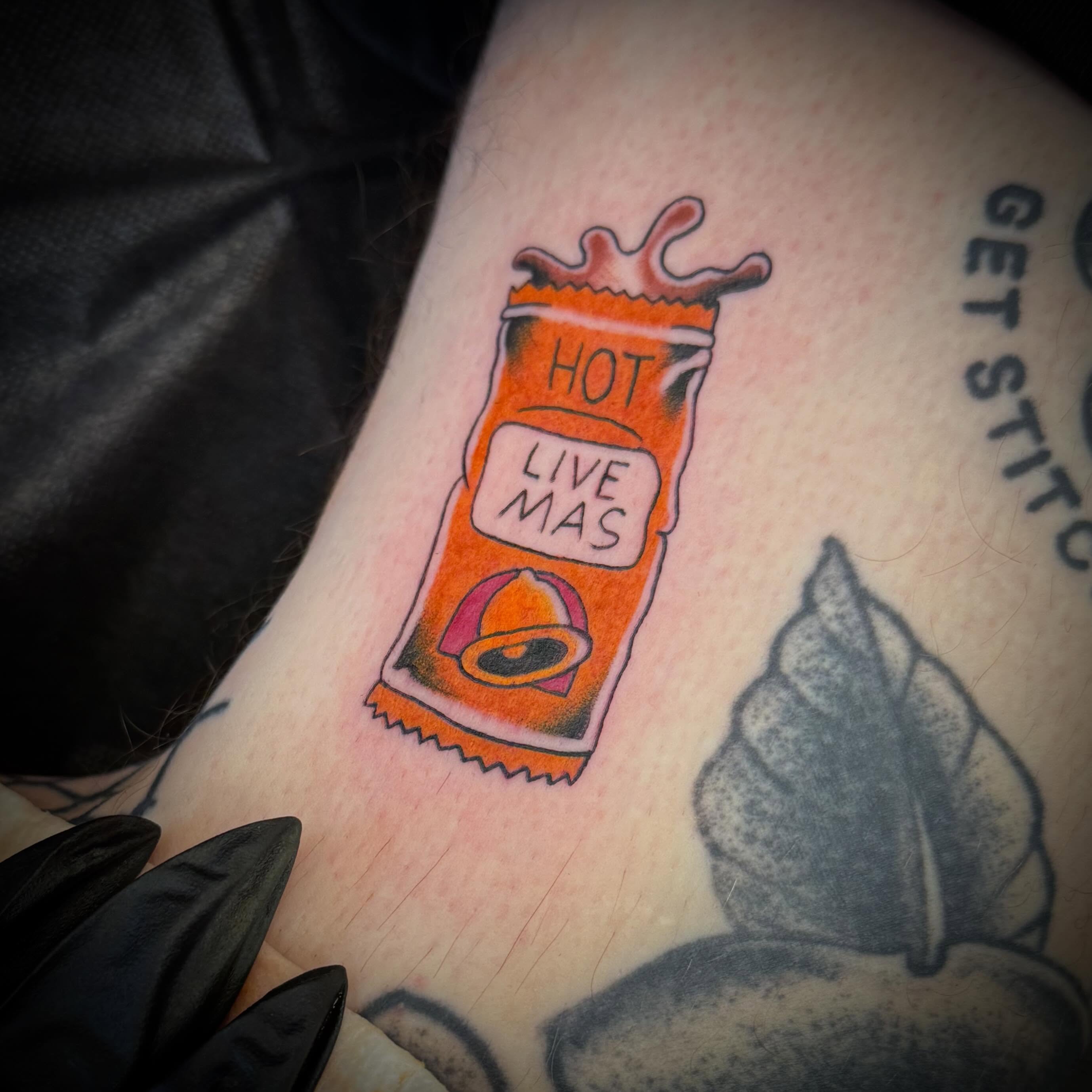 Hot sauce packet new school tattoo on the forearm by ArJay Smith