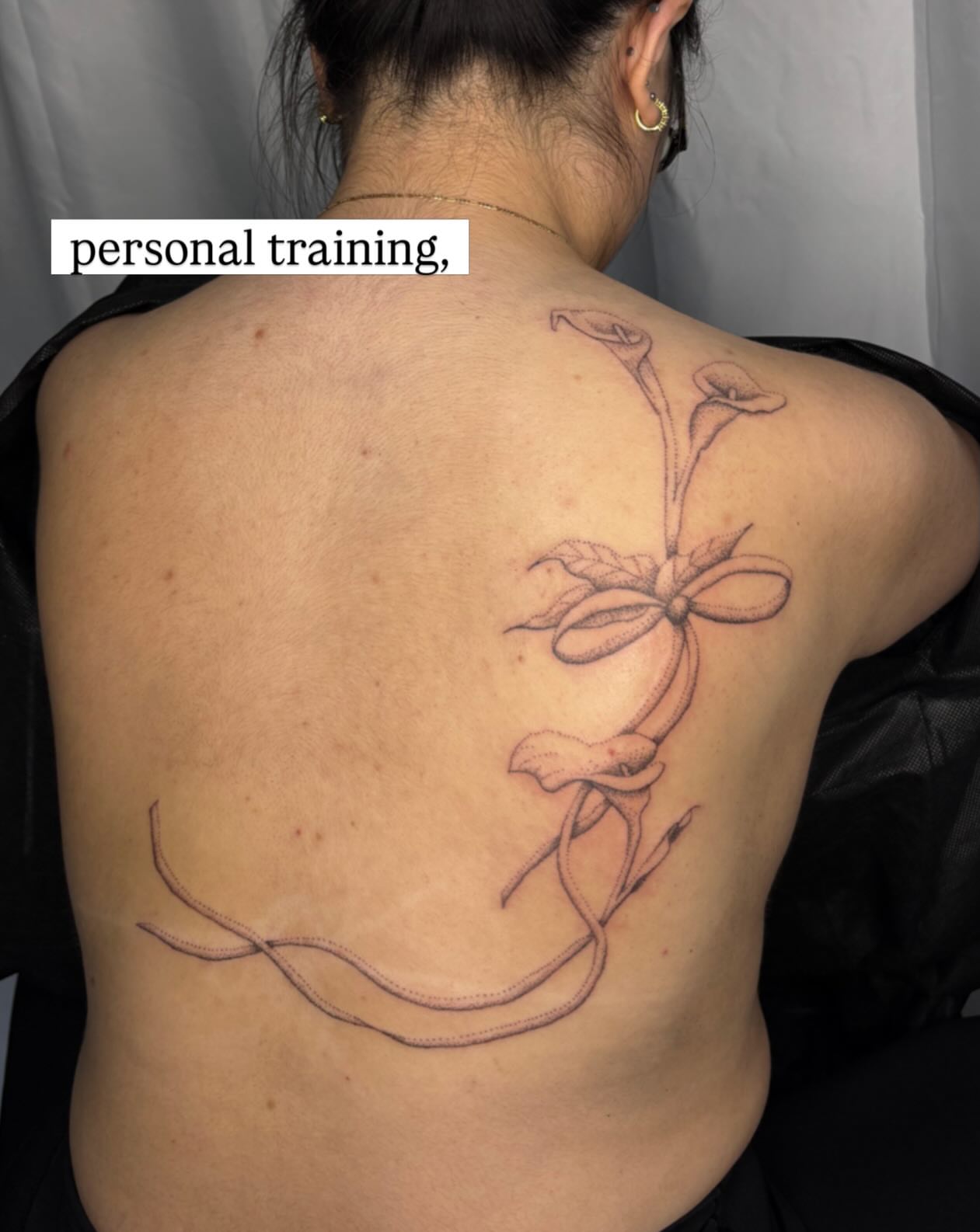 Calla lilies and bow black and grey tattoo on the back by sabrina ✿ ◔ ں ◔ ✿ san francisco tattoo!