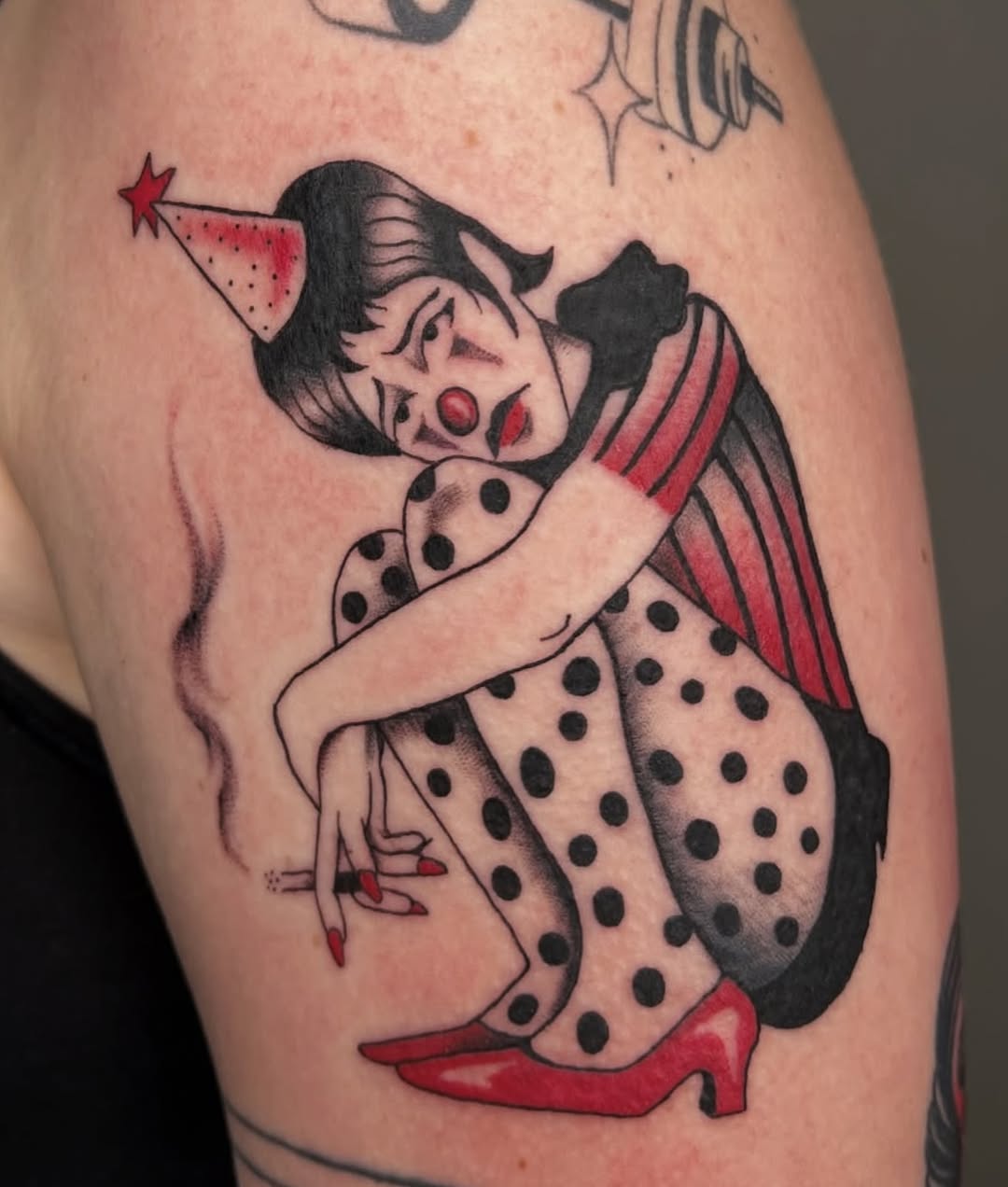 Sad clown smoking neo-traditional tattoo on the upper arm by Elleree (LRE)