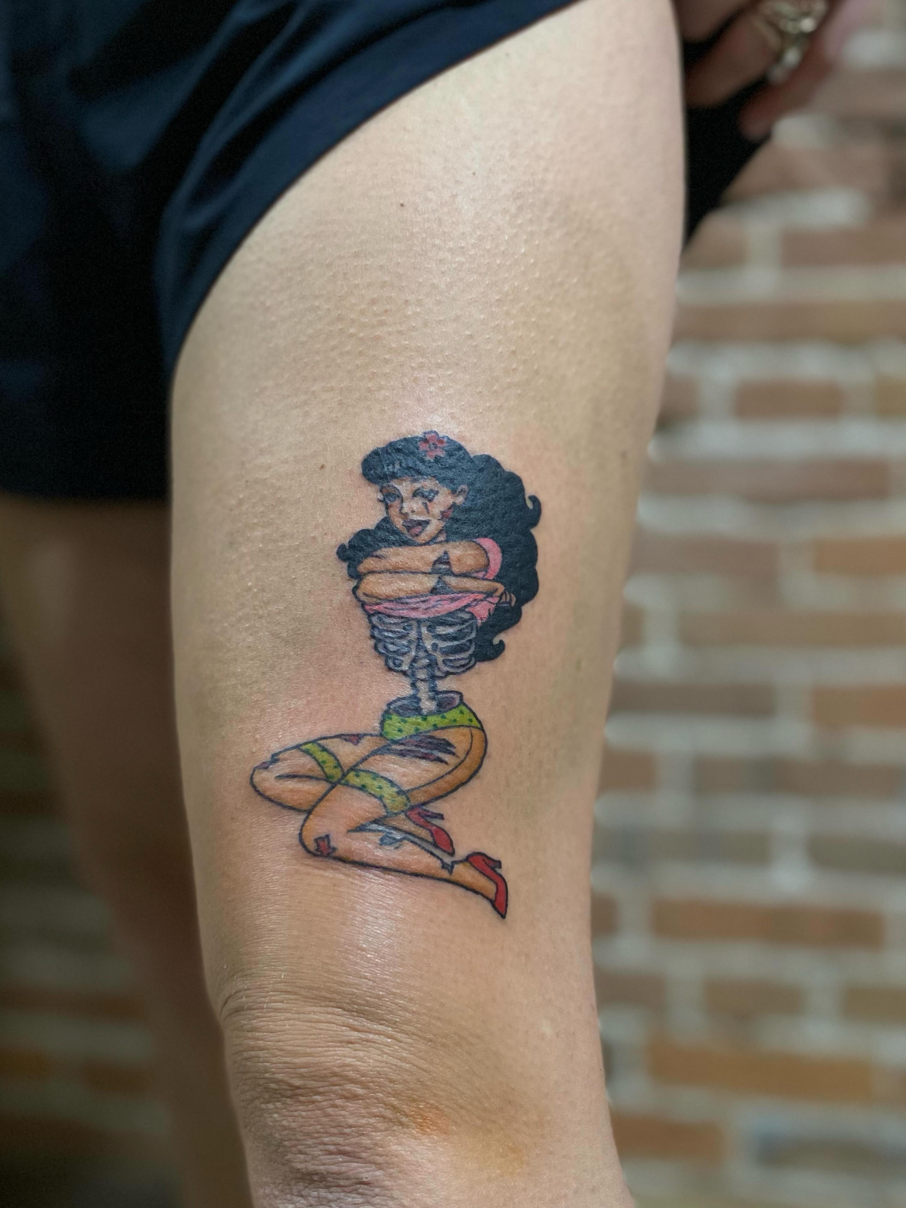 Pin-up girl skeleton American traditional tattoo on the thigh by Tattoo Artist, Kansas City, Missouri