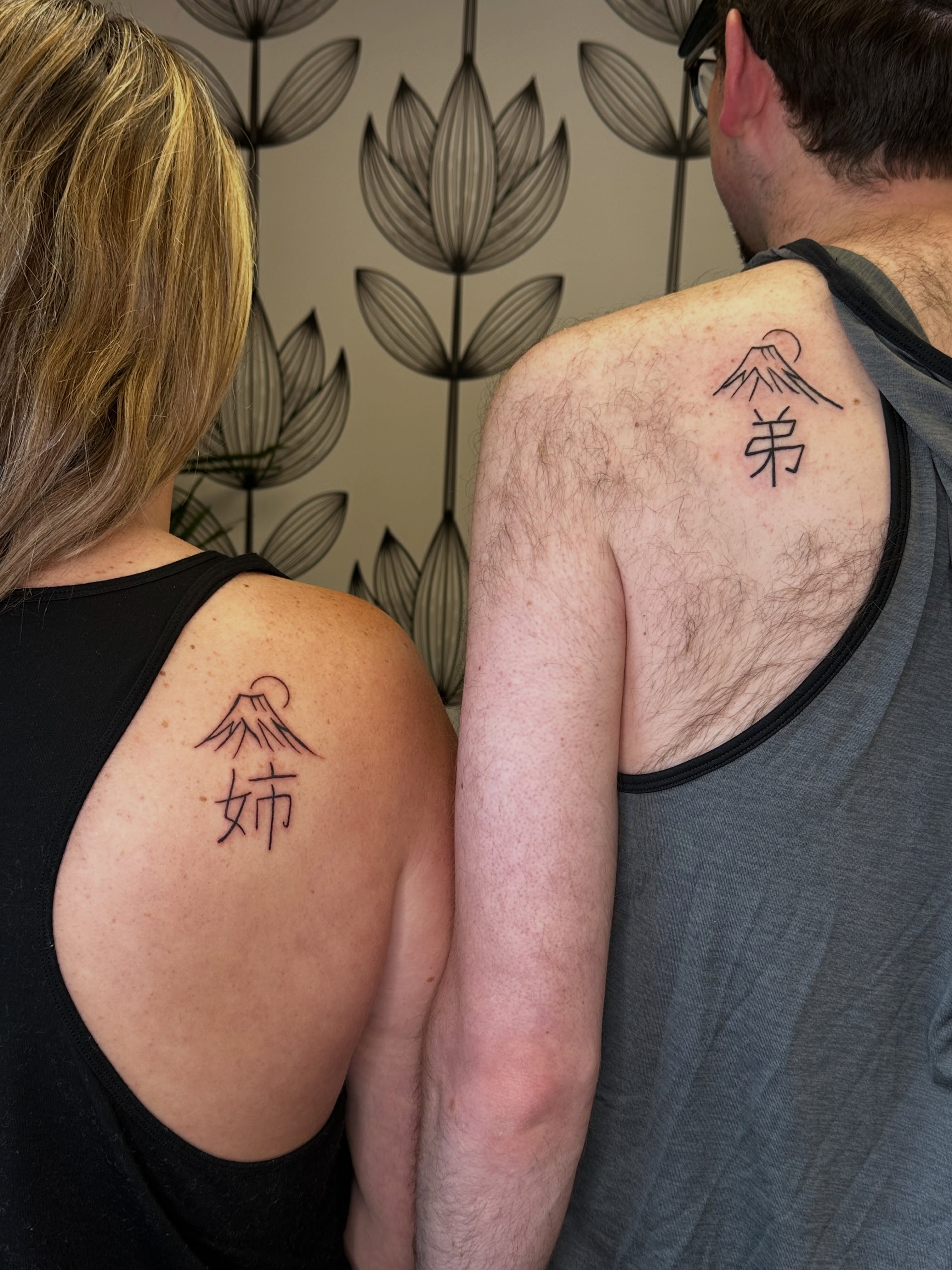 Mountain with kanji black and grey tattoo on the shoulder by Liz