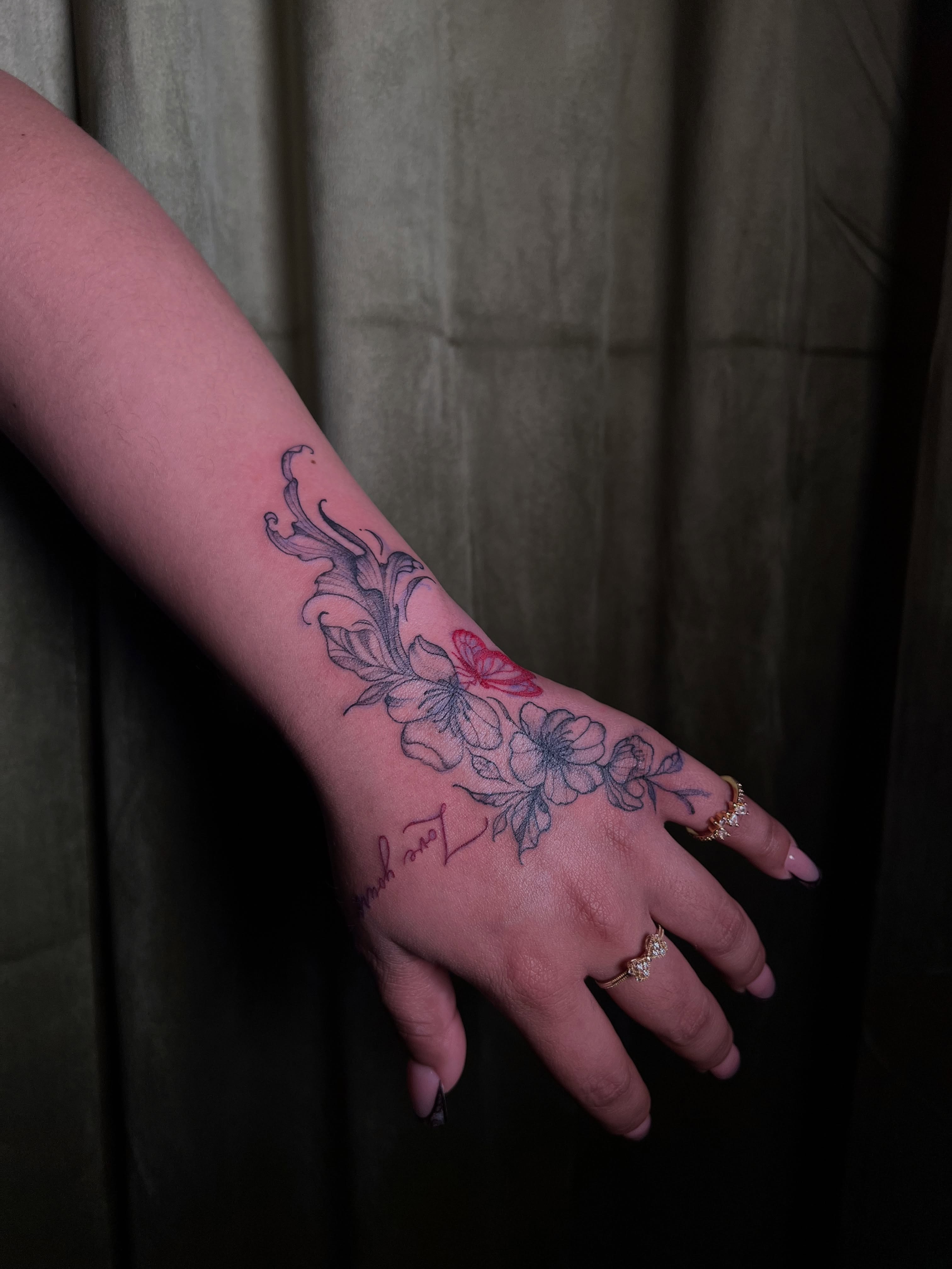 Floral design dotwork tattoo on the hand by V