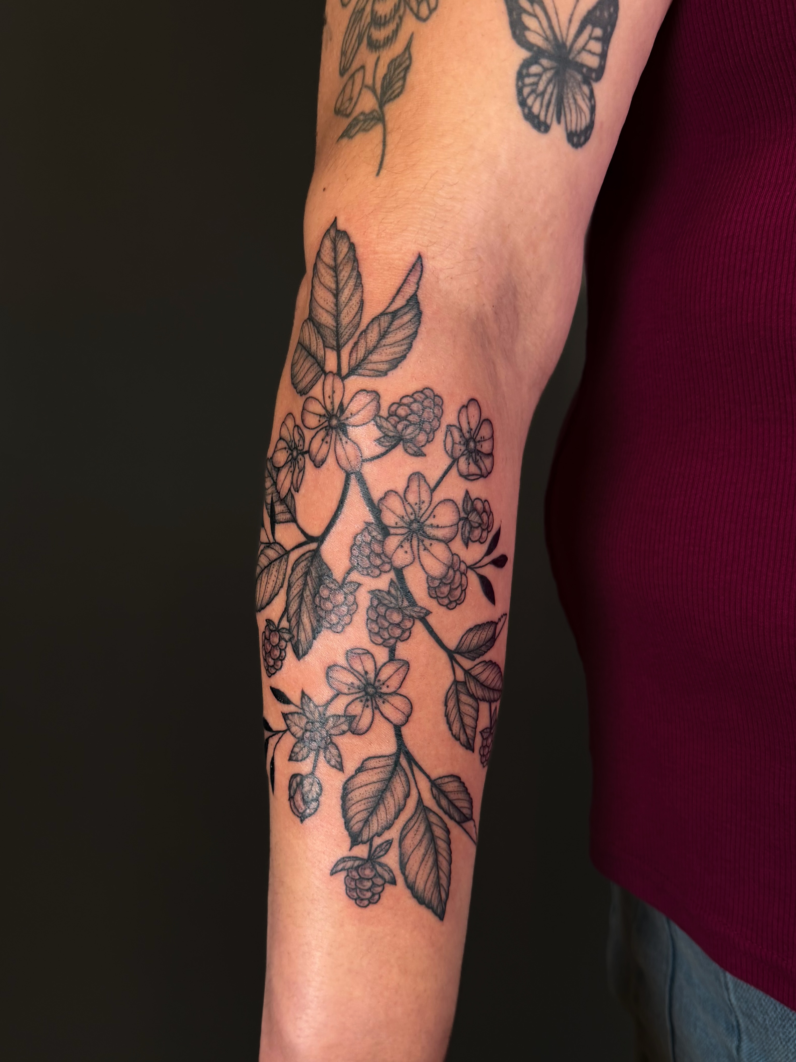 Flower and leaf pattern black and grey tattoo on the forearm by Hannah, Portland, Oregon