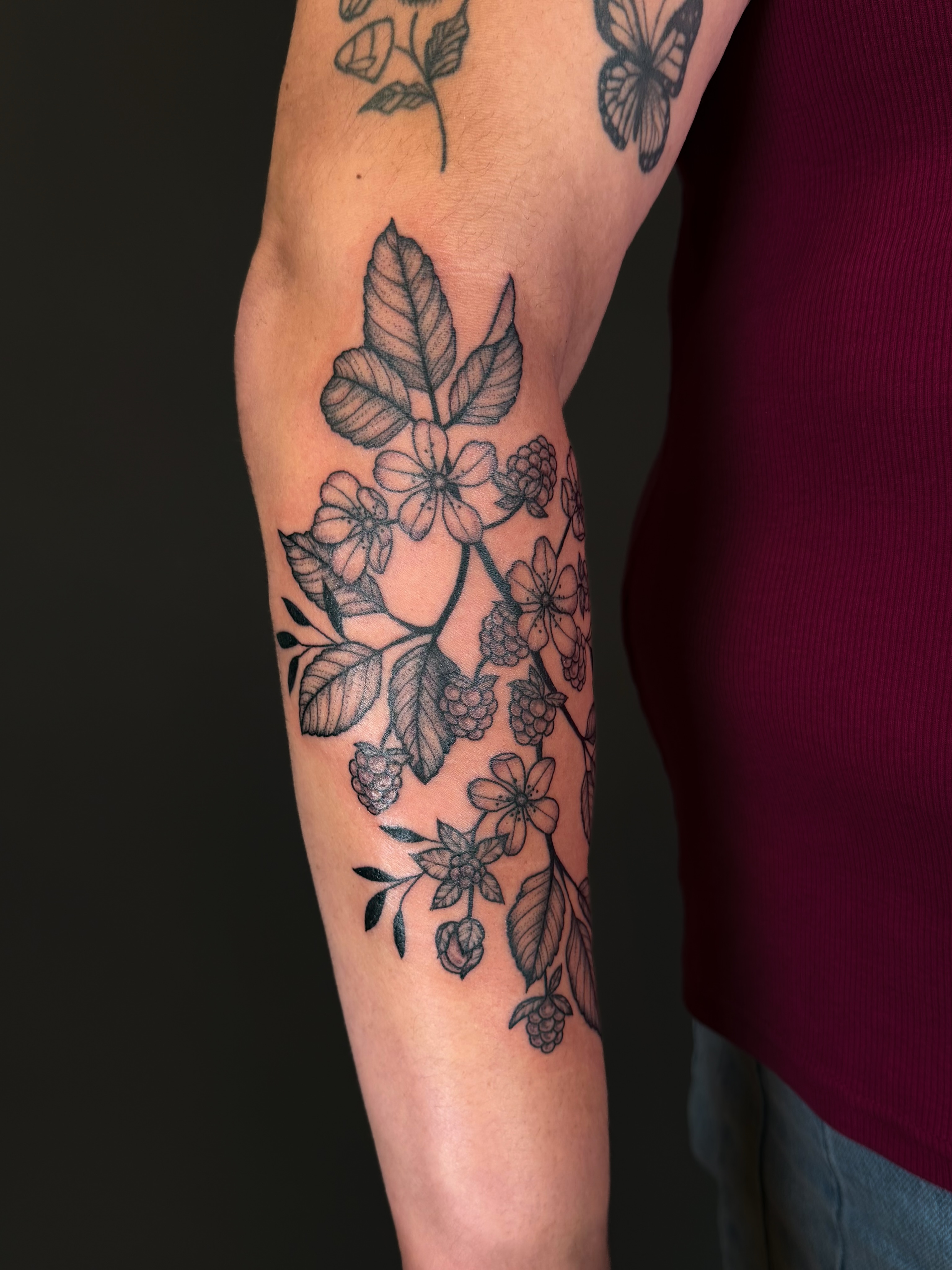 Flower and leaves black and grey tattoo on the forearm by Hannah, Portland, Oregon