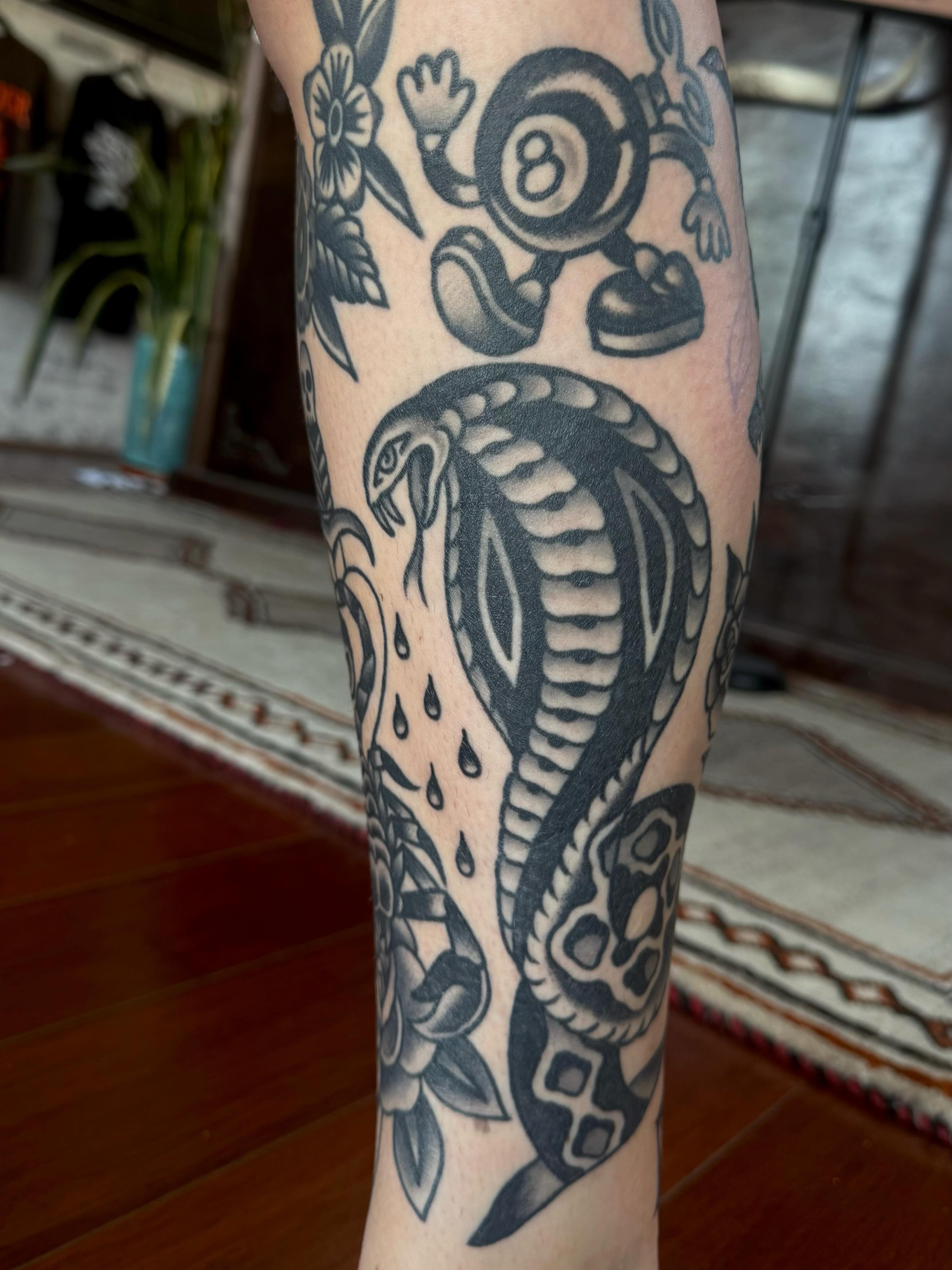 Snake and eight ball American traditional tattoo on the forearm by ༺tessa༻