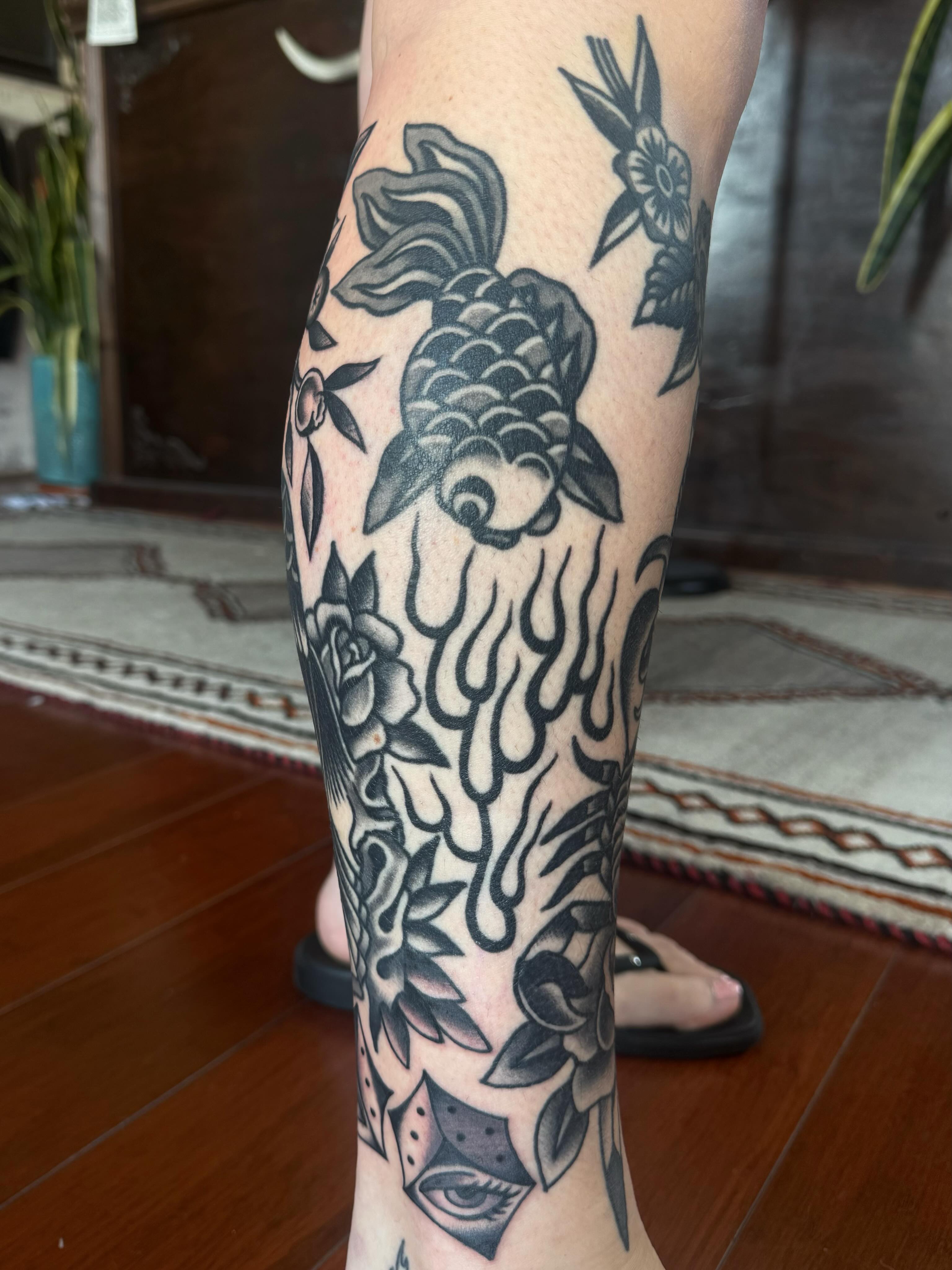 Koi fish and floral black and grey tattoo on the calf by ༺tessa༻