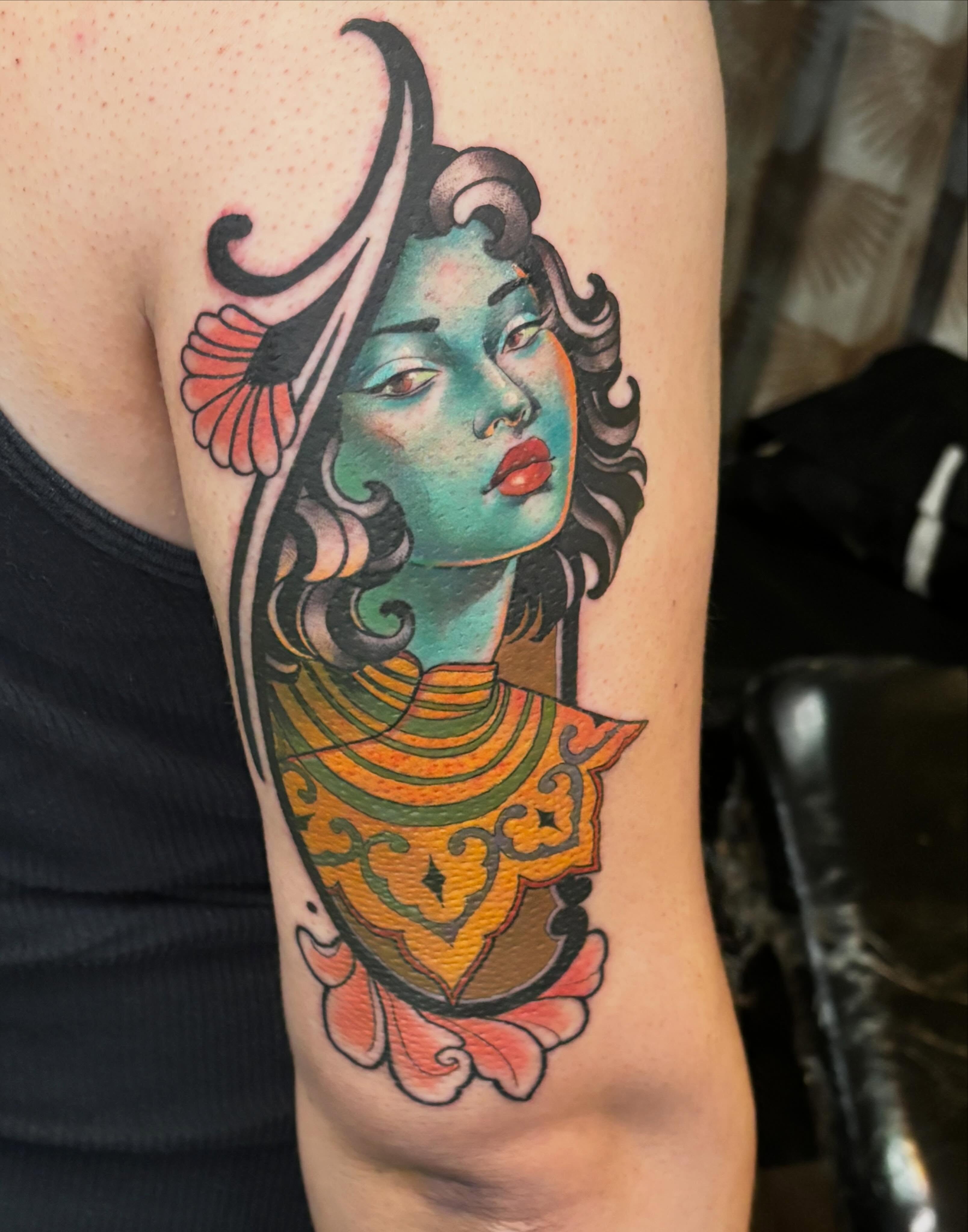 Woman with colorful headdress American traditional tattoo on the forearm by Alex