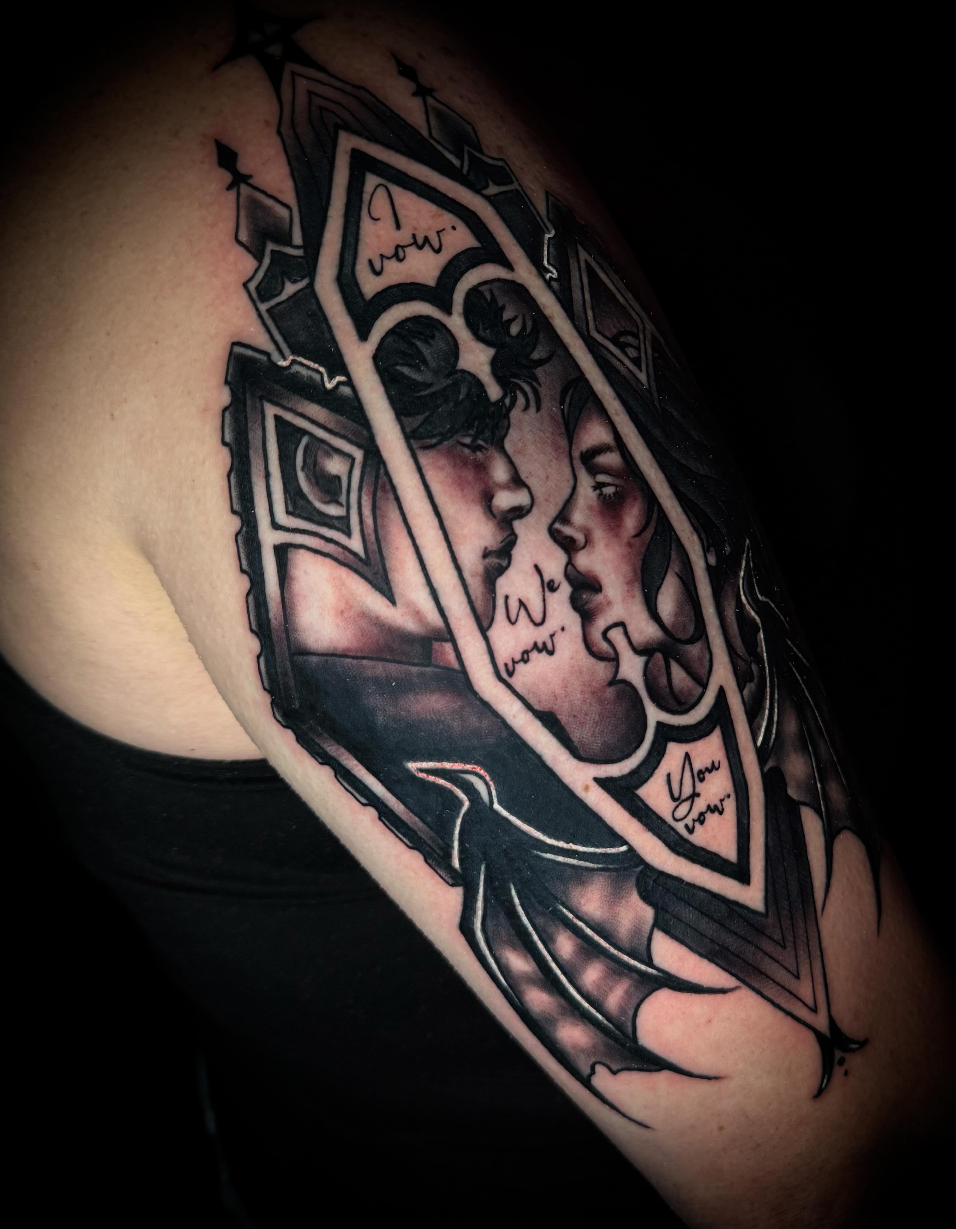 Couple kissing black and grey tattoo on the shoulder by Savannah Duff