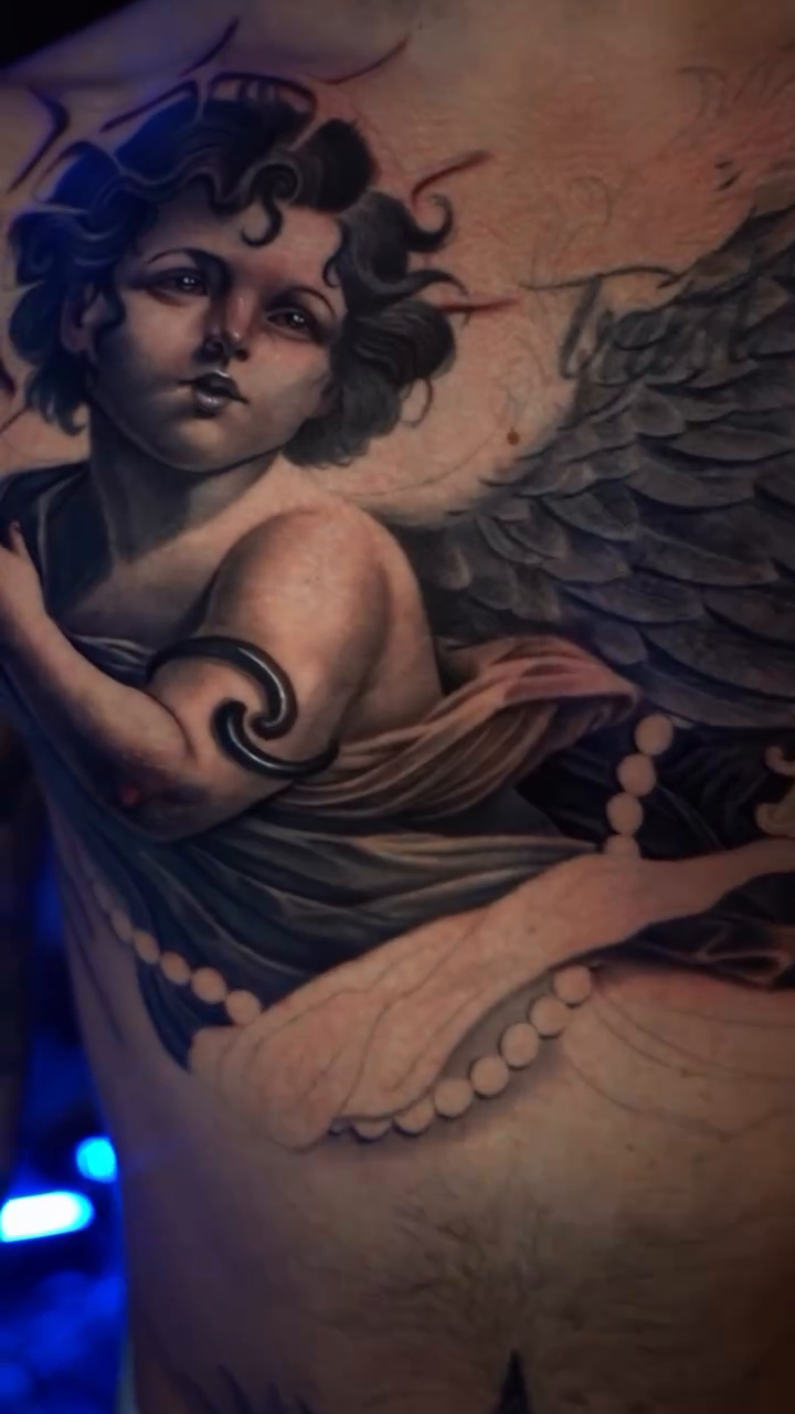 Cherub with wings realism tattoo by Cristian Rodriguez
