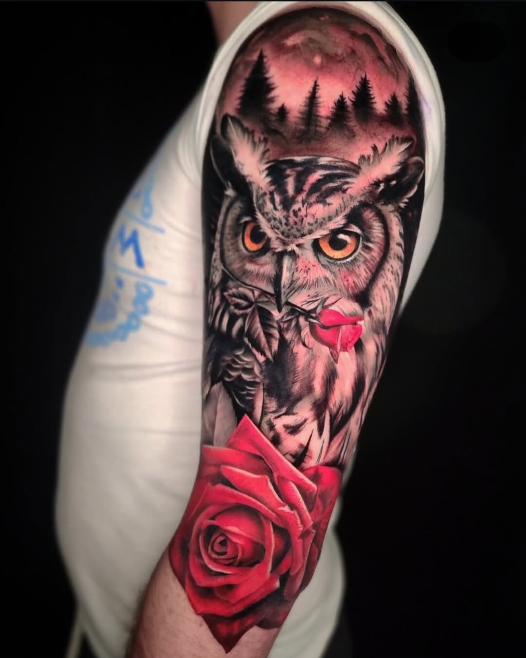 Owl with rose realism tattoo on the forearm by Su Kang