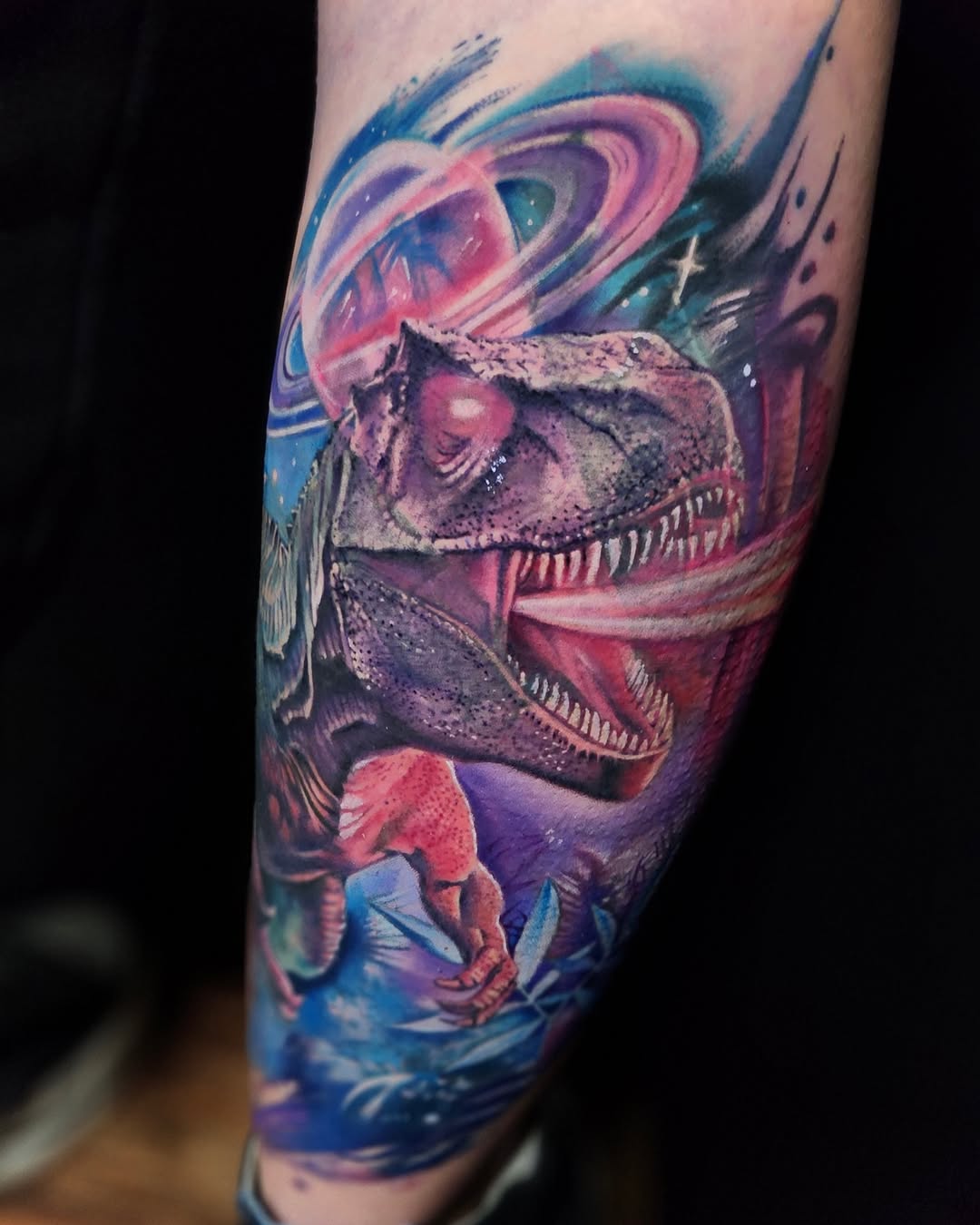 T-Rex dinosaur in space with planets biomech tattoo on the forearm by Su Kang